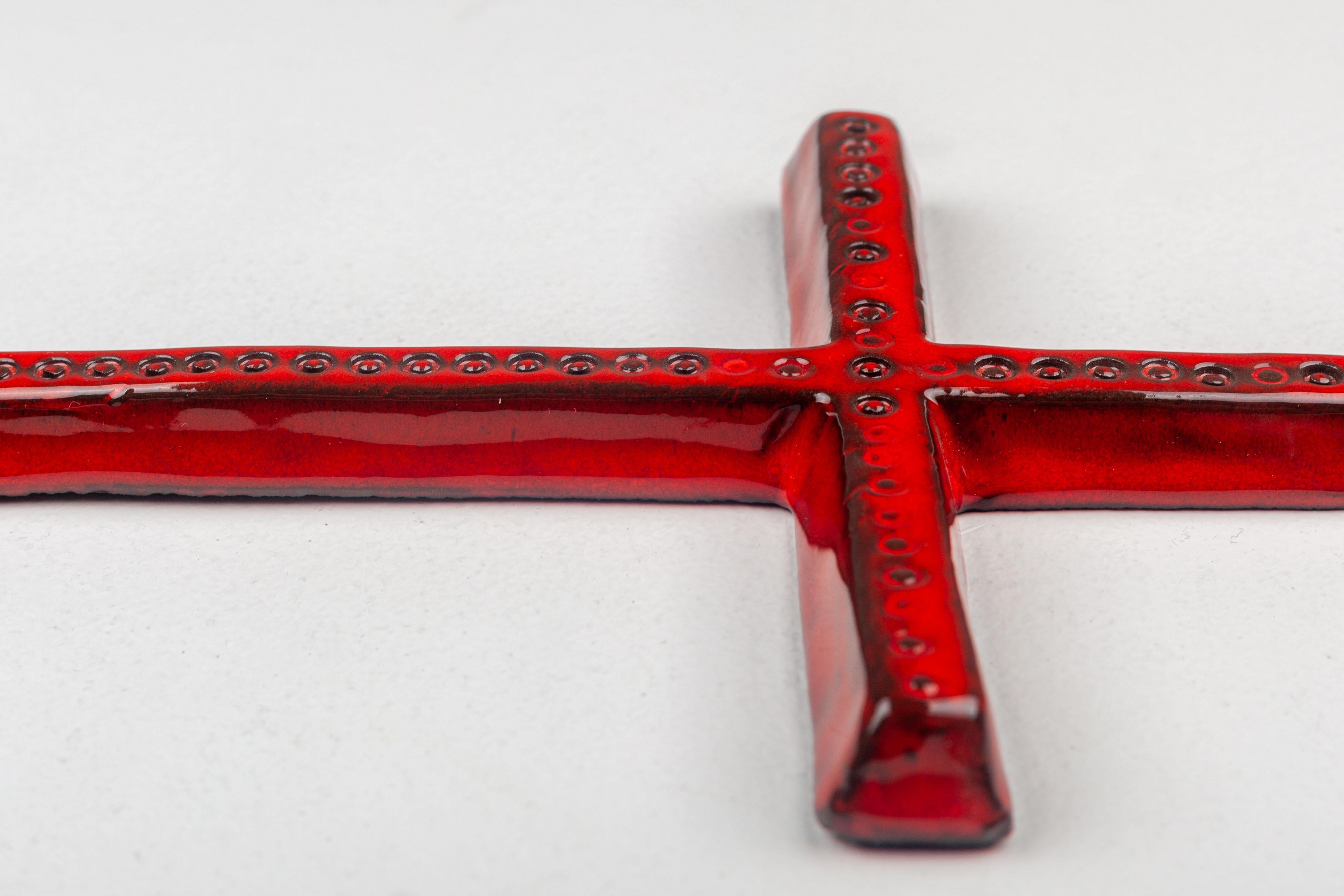 European Mid Century Thin Glossy Red Ceramic Wall Cross with Embossed Circles Pattern For Sale