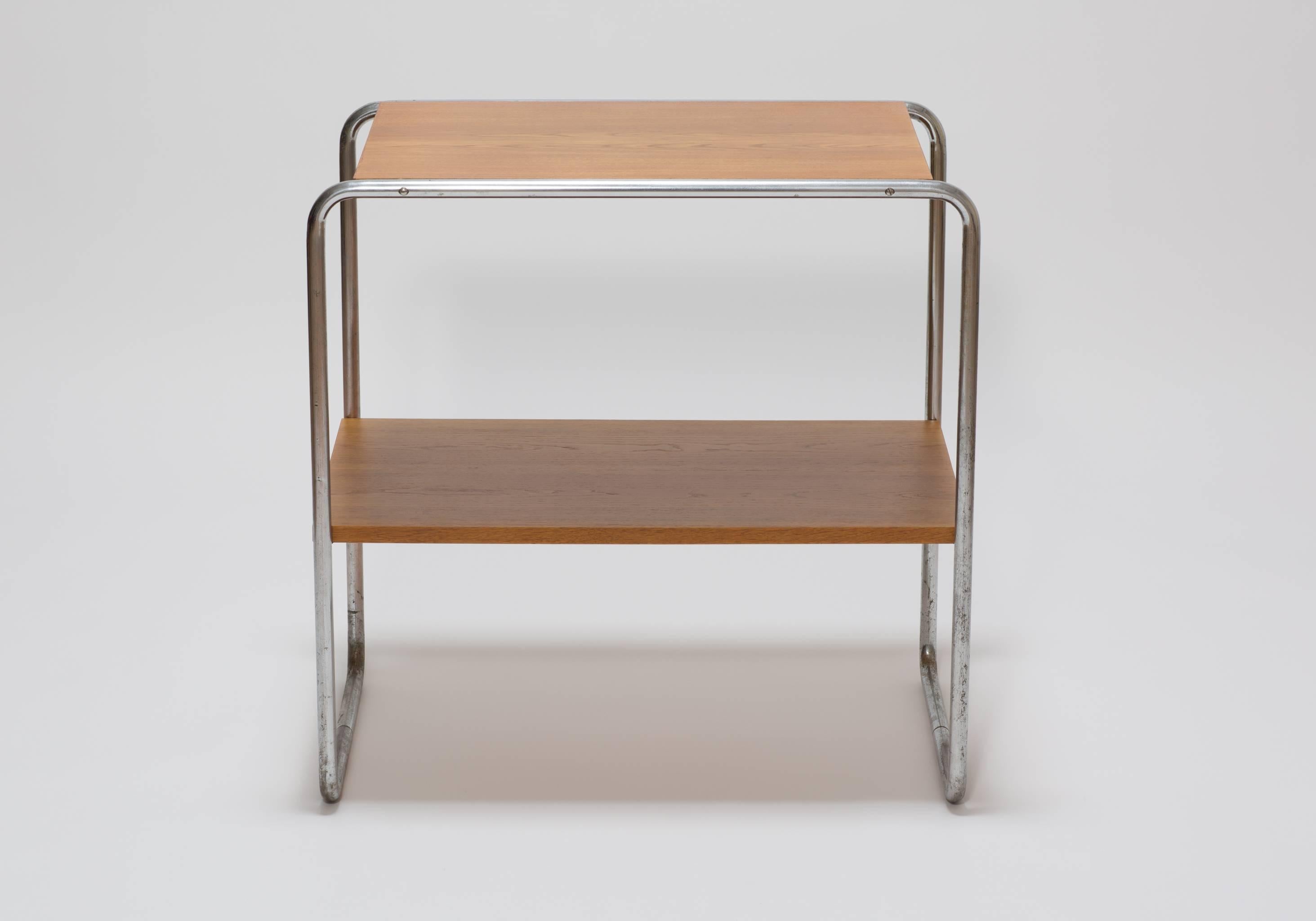 A shelf structure Bauhaus table model B20 designed by Marcel Breuer in 1928 and produced by Thonet between 1930 and 1940. The side table has a chrome-plated tubular steel frame and two oak boards.

The table would make an eye-catching addition to