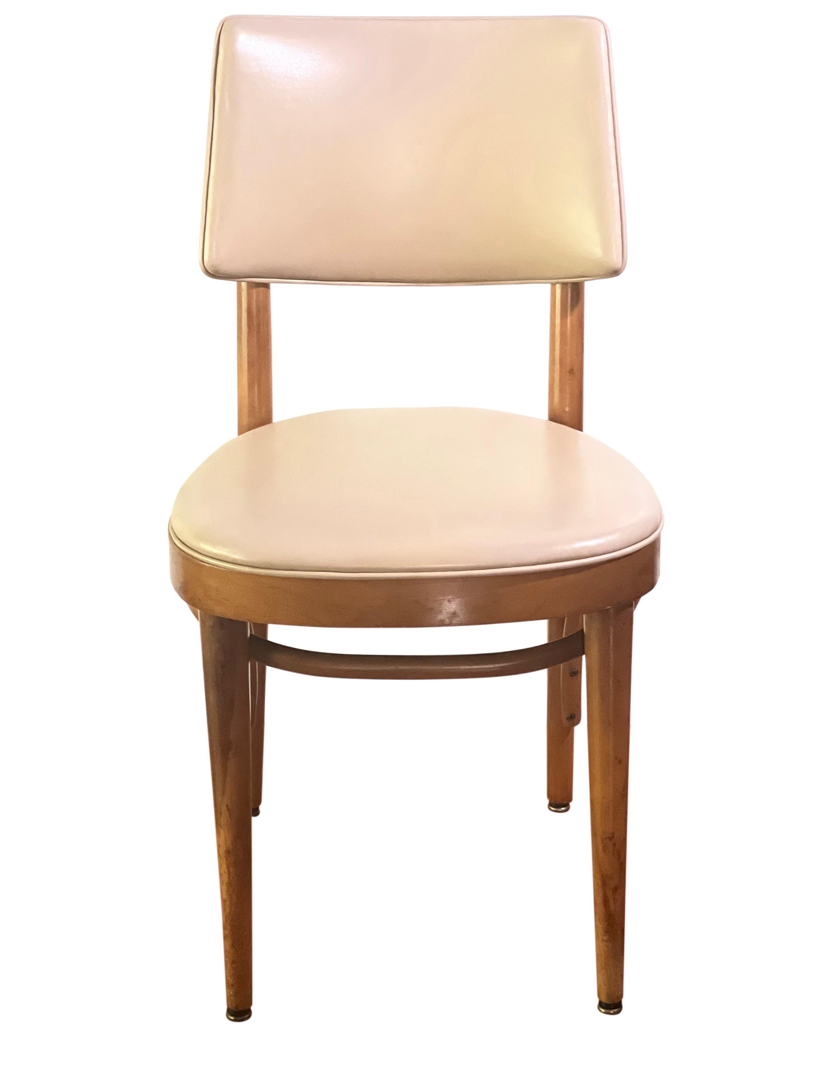 Midcentury Thonet bentwood upholstered chair.

Single chair with Classic midcentury design with bentwood base. Neutral cream Naugahyde upholstery in very good condition. It features a generous, comfortable backrest. Great chair perfect for so many
