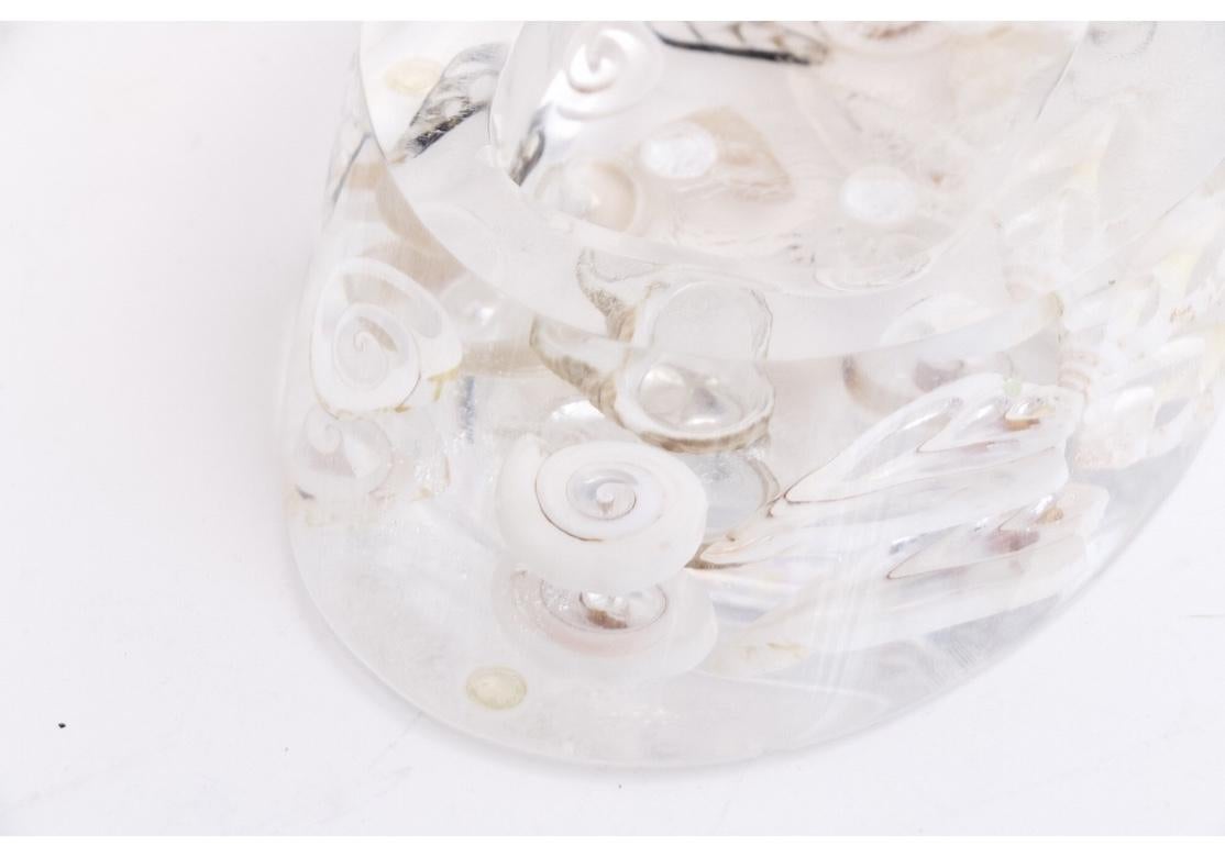 An amazing group of three vintage Lucite accessories for the powder room; wastebasket, tissue holder and soap-dish. Each piece has meticulously embedded slices of pearl shells that add a jewelry like component to the already light filled Lucite