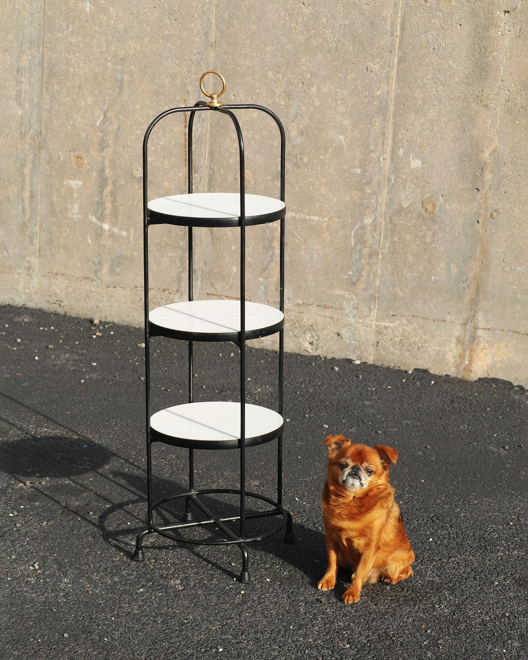 For your consideration is this midcentury American 3-tier etagere featuring a metal tube welded frame with black finish, three 11.75