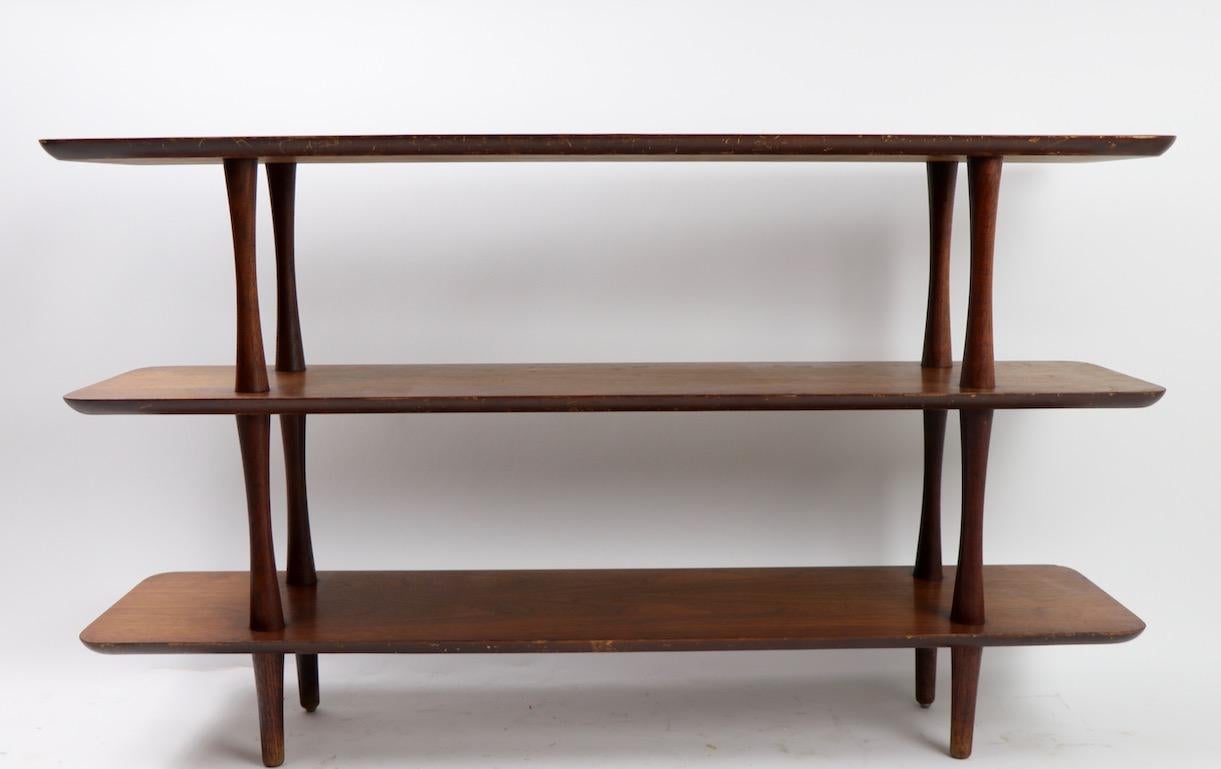 Architectural design Mid-Century Modern period three tier shelf design in the style of Paul McCobb. Free standing shelves are not often seen from this period, perfect for components, books, or to display objet. Structurally sound and sturdy, finish