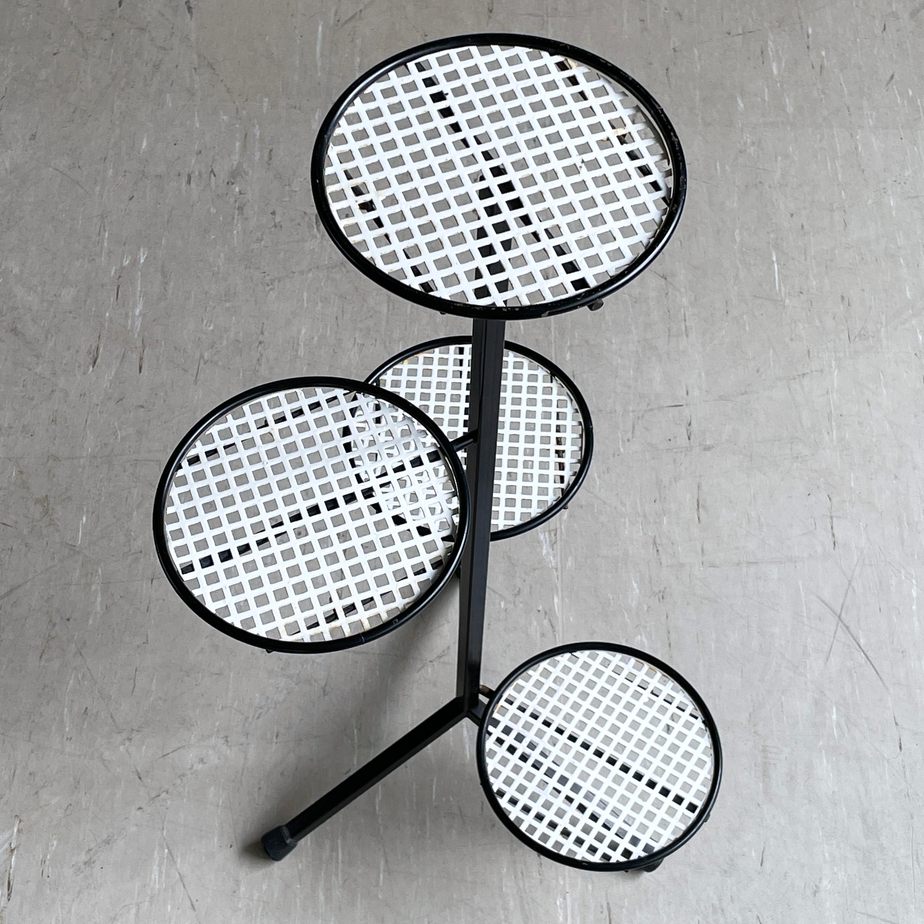 Stylish Mid Century Swiss tiered plant stand made of perforated metal with rubber feet. Reputedly produced for Möbel Pfister, Switzerland in the late 1950’s, early 1960's (unconfirmed). 
