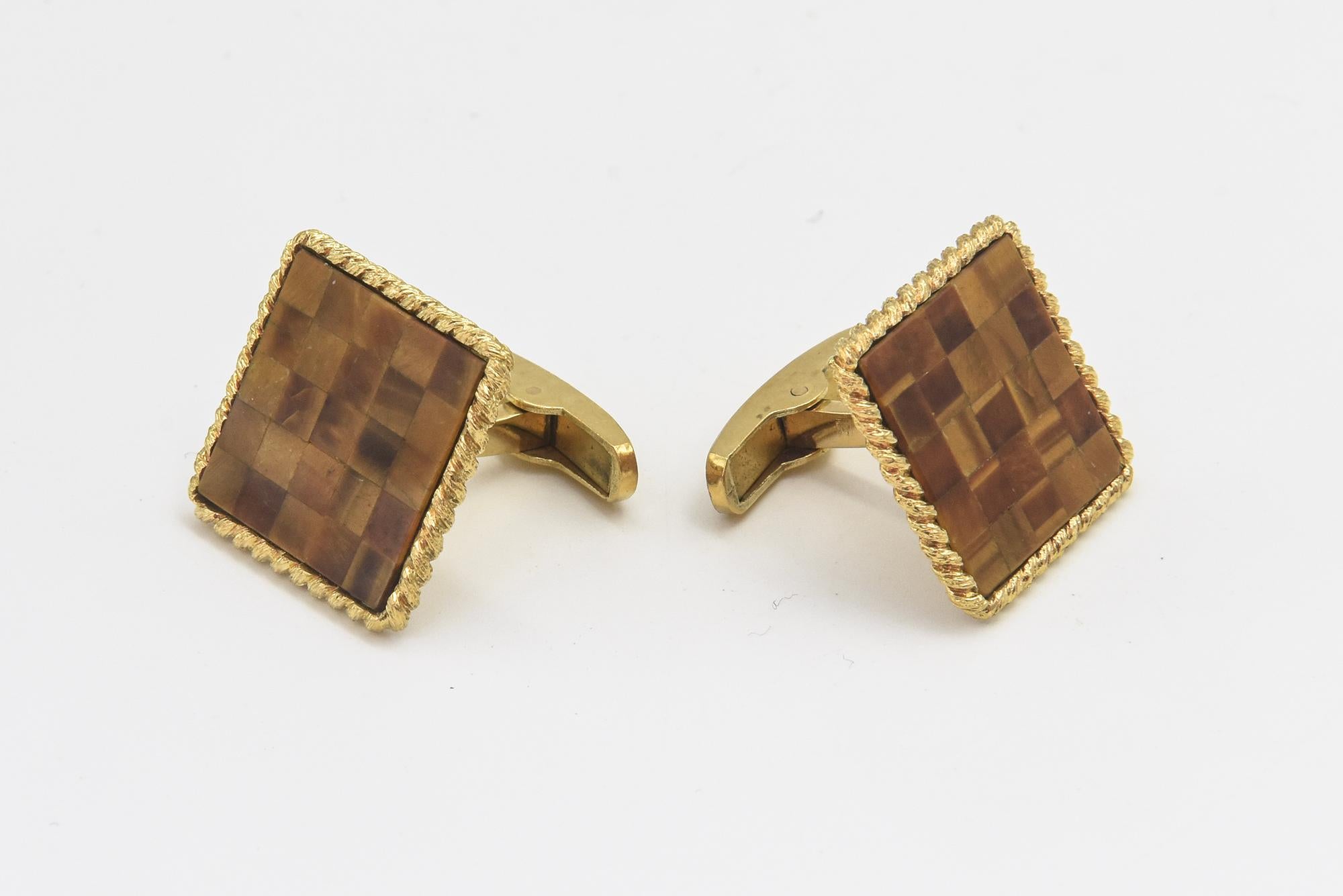 Checkerboard mosaic made with pieces of tiger's eye set within a twisted 14k yellow gold frame to make a stunning pair of cufflinks from the 1960s.  These impressive cufflinks have an easy to use t-bar closure.  They are stamped AR 14k.