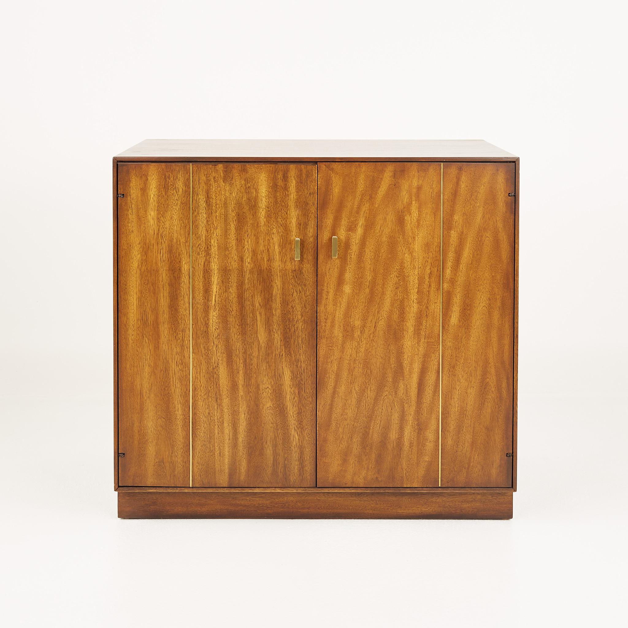 Mid century tigerwood and brass bar record media base cabinet credenza

Credenza measures: 31.5 wide x 19 deep x 29.25 inches high

All pieces of furniture can be had in what we call restored vintage condition. That means the piece is restored