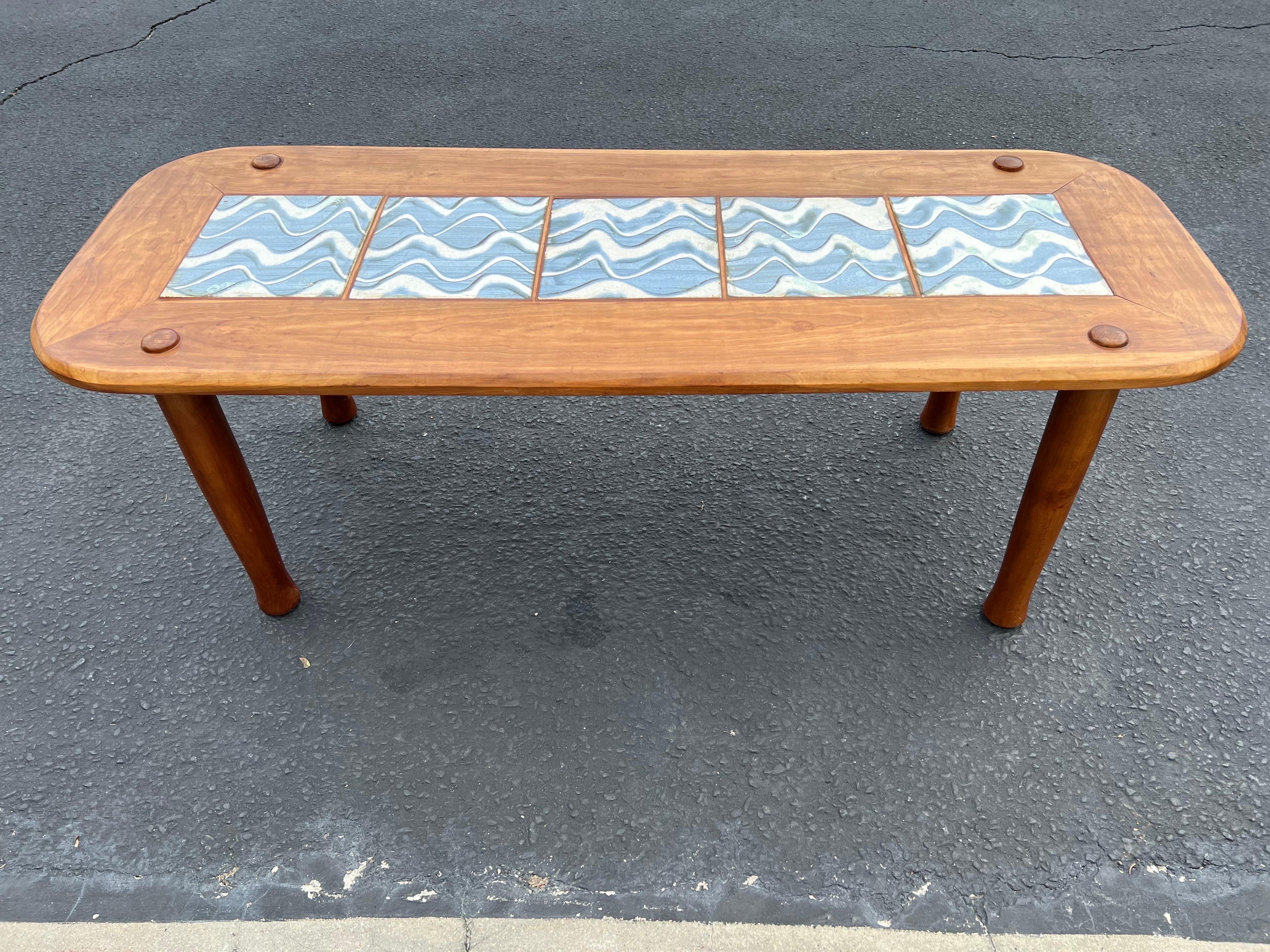 Mid Century Tile and Wood Coffee Table. In the style of Gangso Mobler . Soft blue and white ceramic tile top with round accents above leg base. Solid and durable.