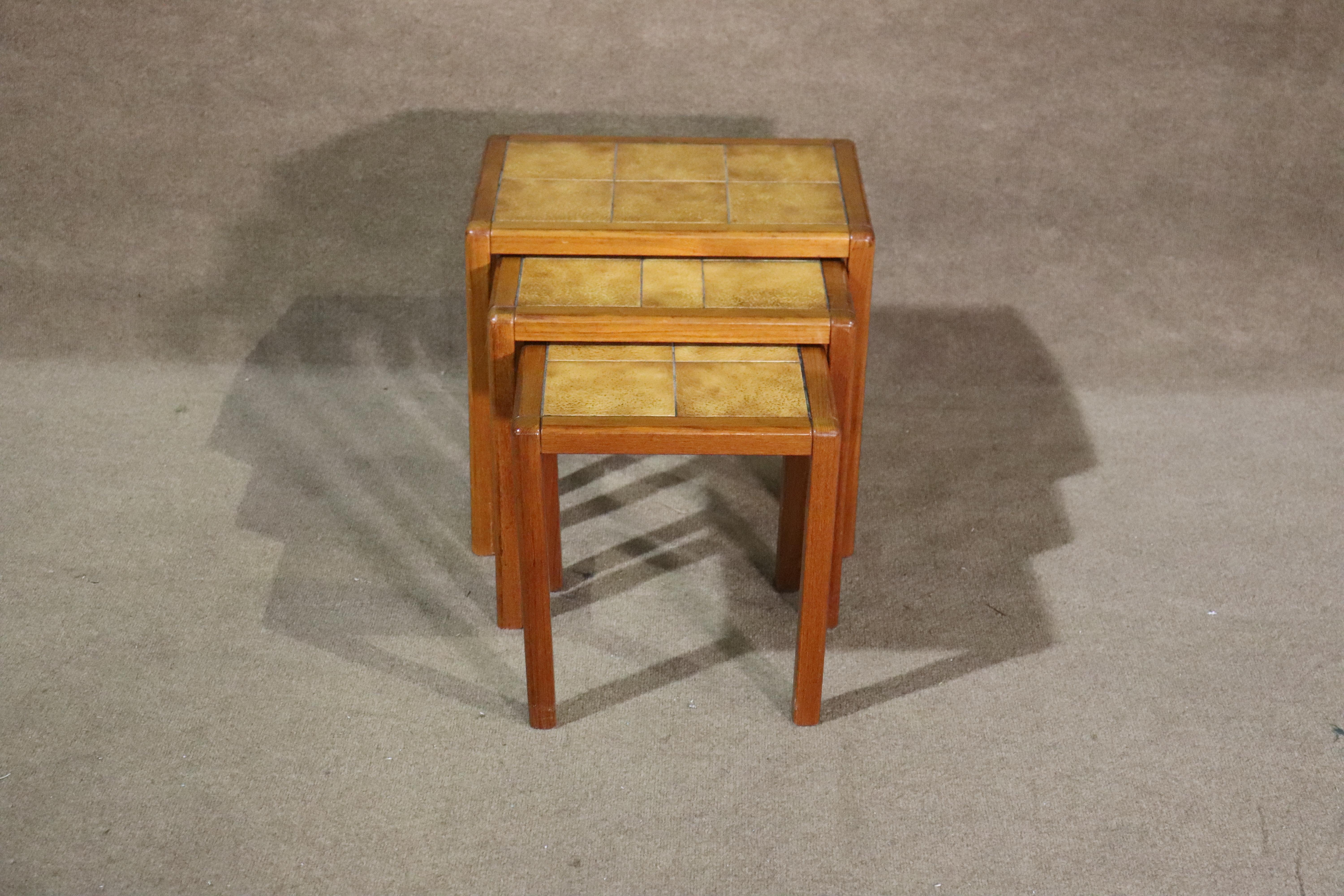 Set of vintage nesting tables made of teak wood and ceramic tiles. Great for entertaining, and easy to stow away.
Please confirm location NY or NJ