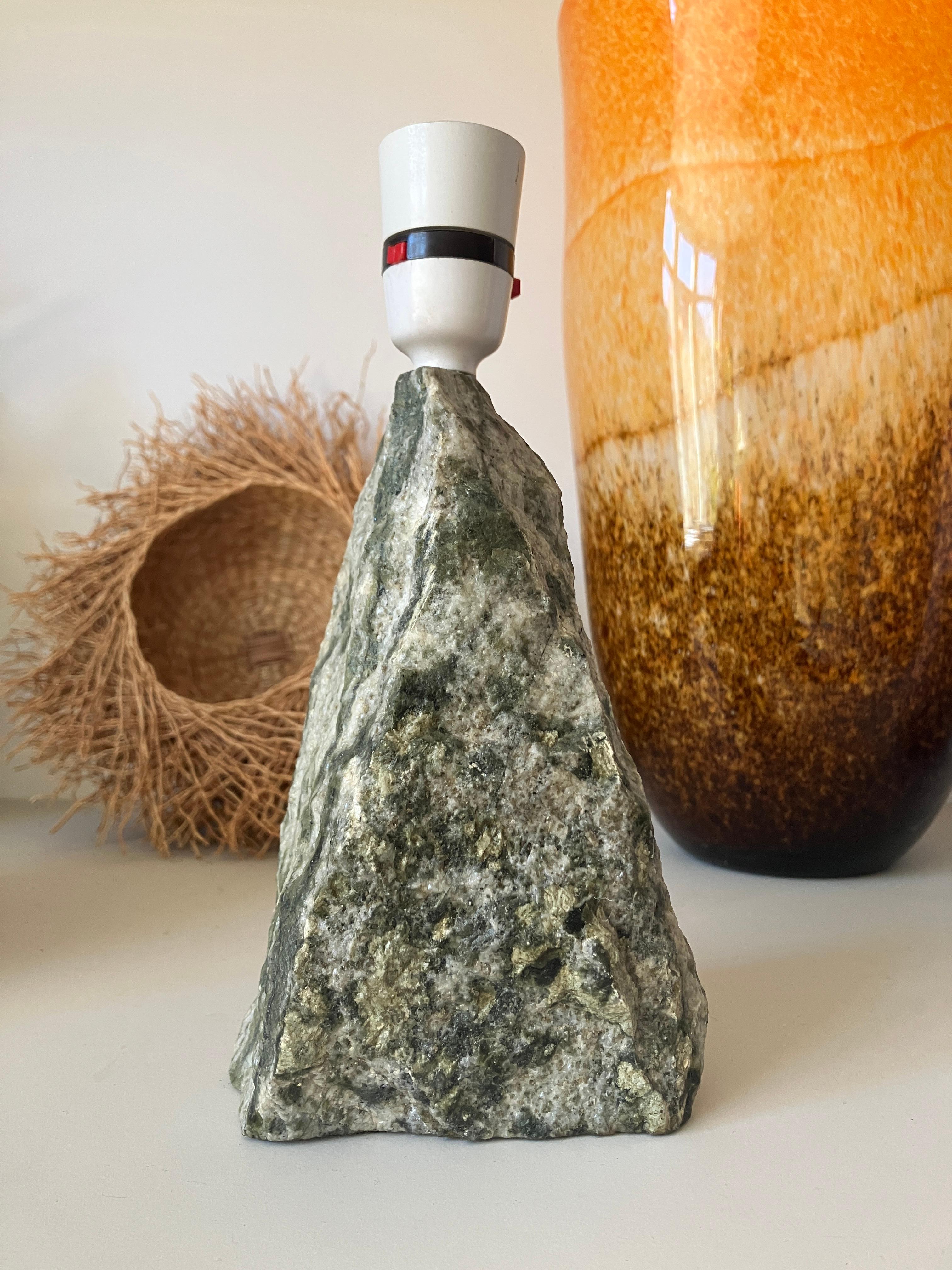 A stunning marble stone lamp base from Scotland. The marble has green-grey hues, specific to Dunkeld in Scotland. Lovely chiseled obelisk shape and a gorgeous rough stone finish. 

This Scottish marble lamp has a leather base and a sticker saying;