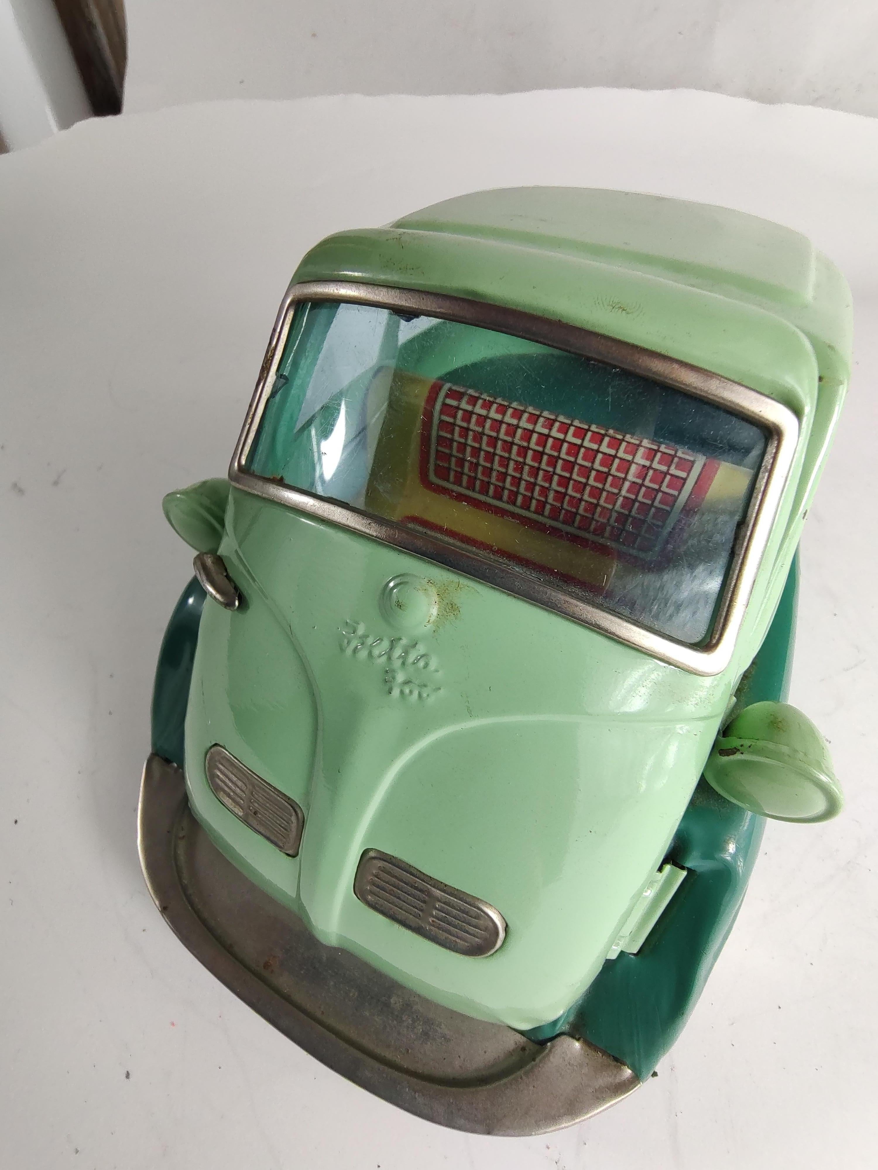 Fabulous and as near mint as it gets. Never played with and in excellent vintage condition. This and 16 other late fifties and early sixties japanese tin toys have come out of the attic. The Isetta is in magnificent condition with little blemishes