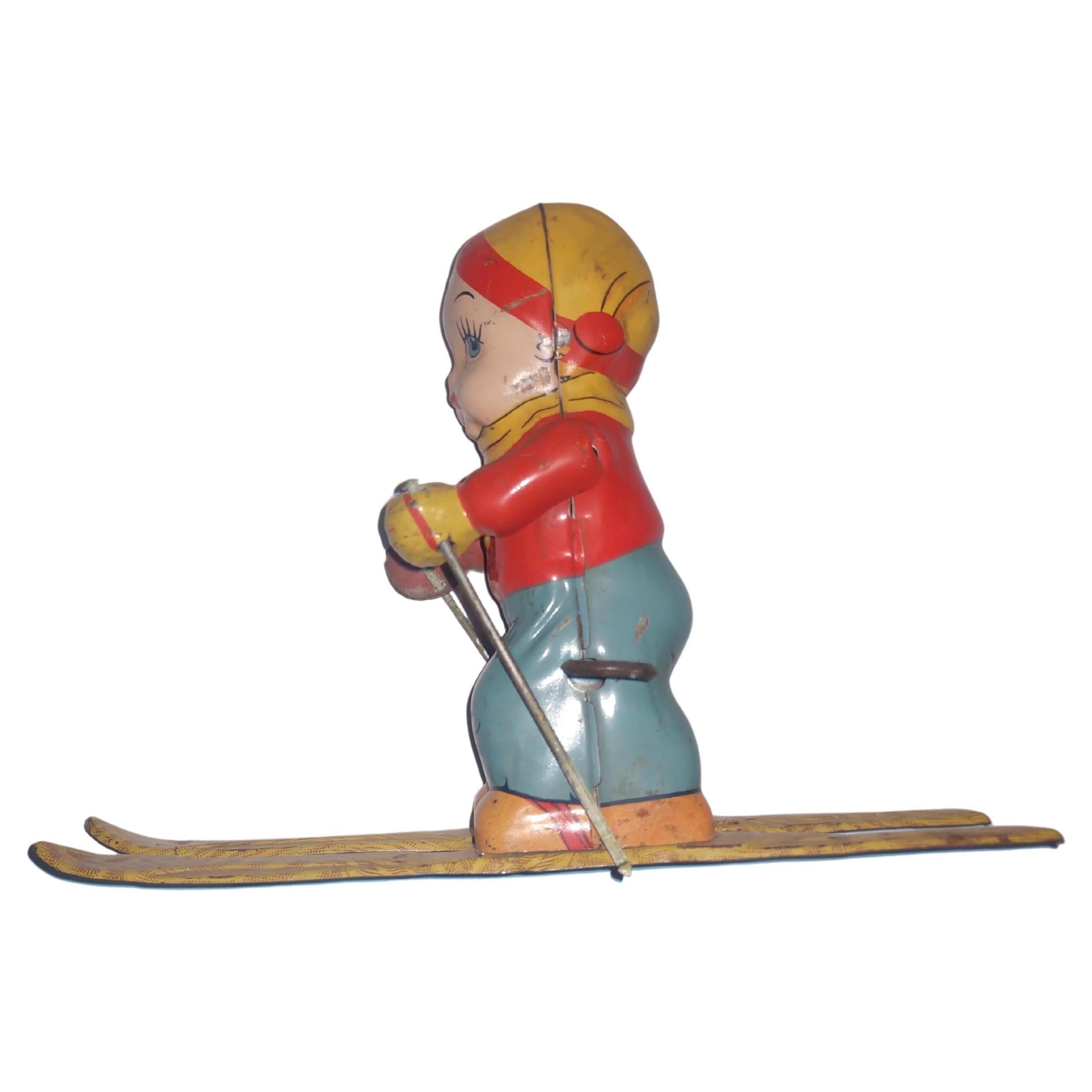 Industrial Mid Century Tin Litho Mechanical Clockwork Windup Toy Skier Girl by Chein C1945 For Sale