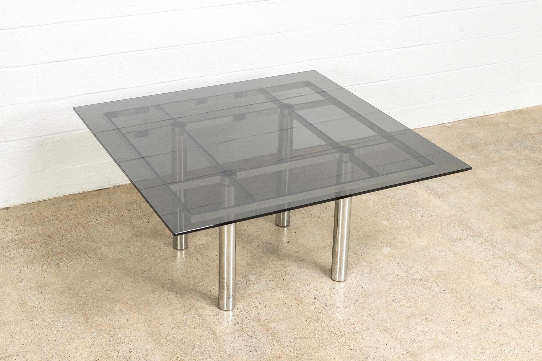 This midcentury modernist “Andre” square glass and chrome table designed by Tobia Scarpa for Knoll International is circa 1970. The table is heavy and solid and exceptionally crafted from premium materials. The sleek design has a clean Minimalist