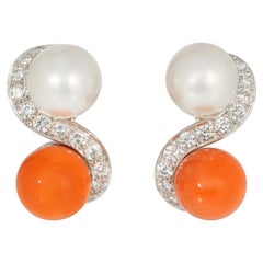 Mid-century toi et moi pearl, coral, and diamond earrings