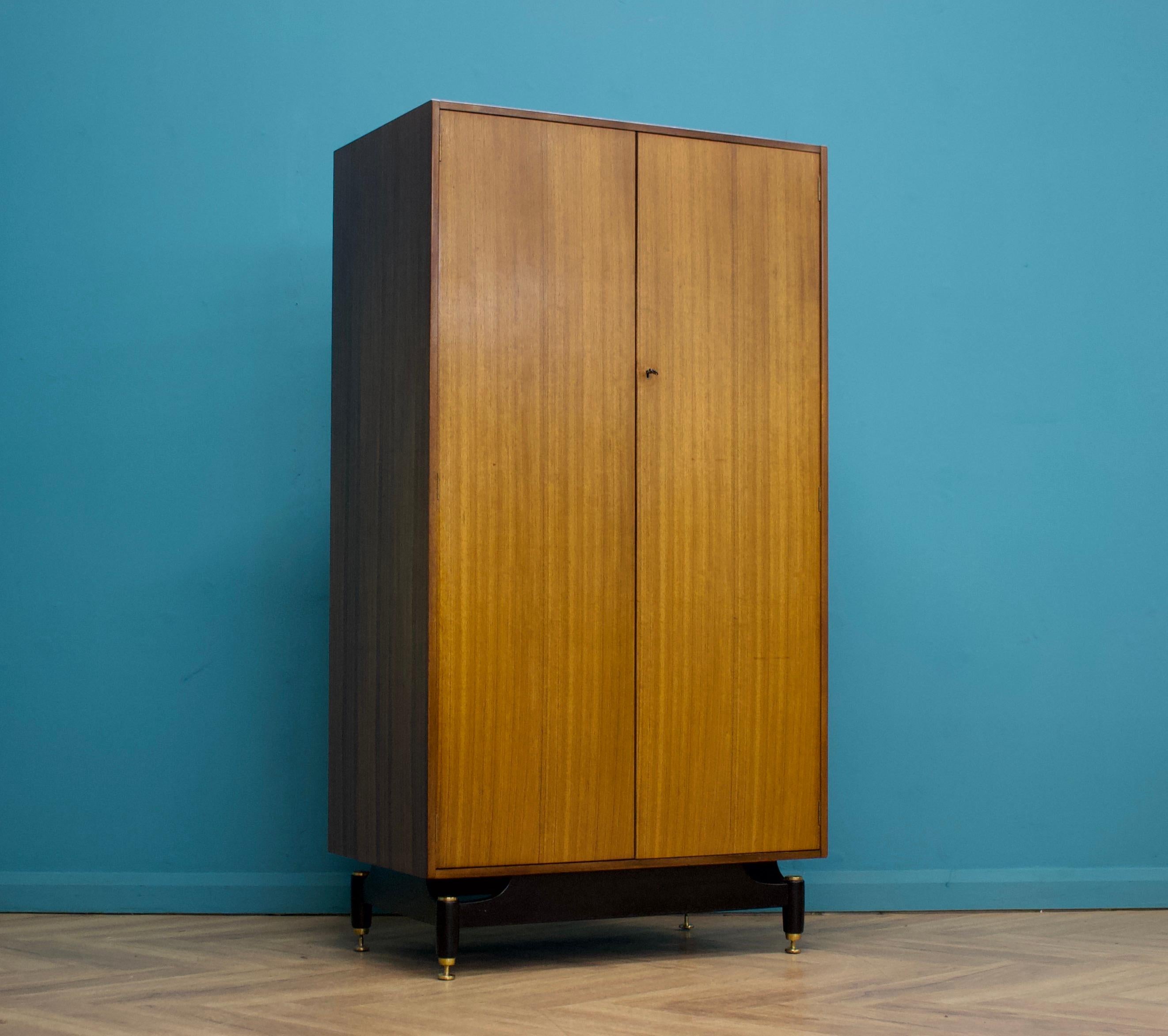 A freestanding double door wardrobe from G Plan - circa 1960s

Fitted out with a clothes rail the full width
Complete with a working lock