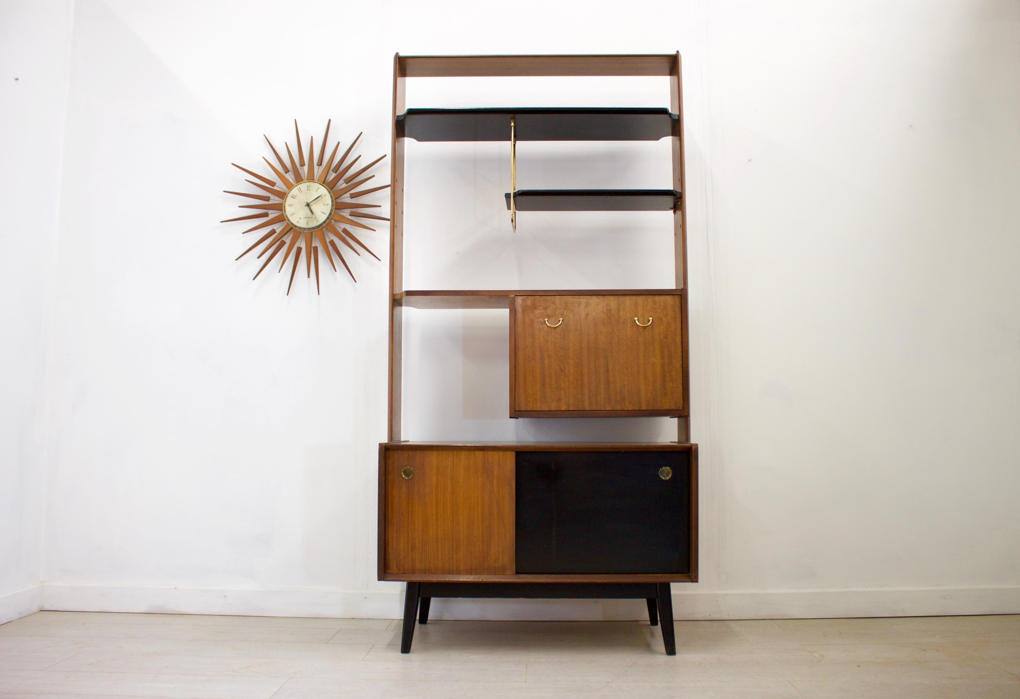 Vintage design

- Mid-Century Modern room divider
- Manufactured by G Plan in the UK
- Features a drinks cabinet
- Made from Afromosia which is an African teak.