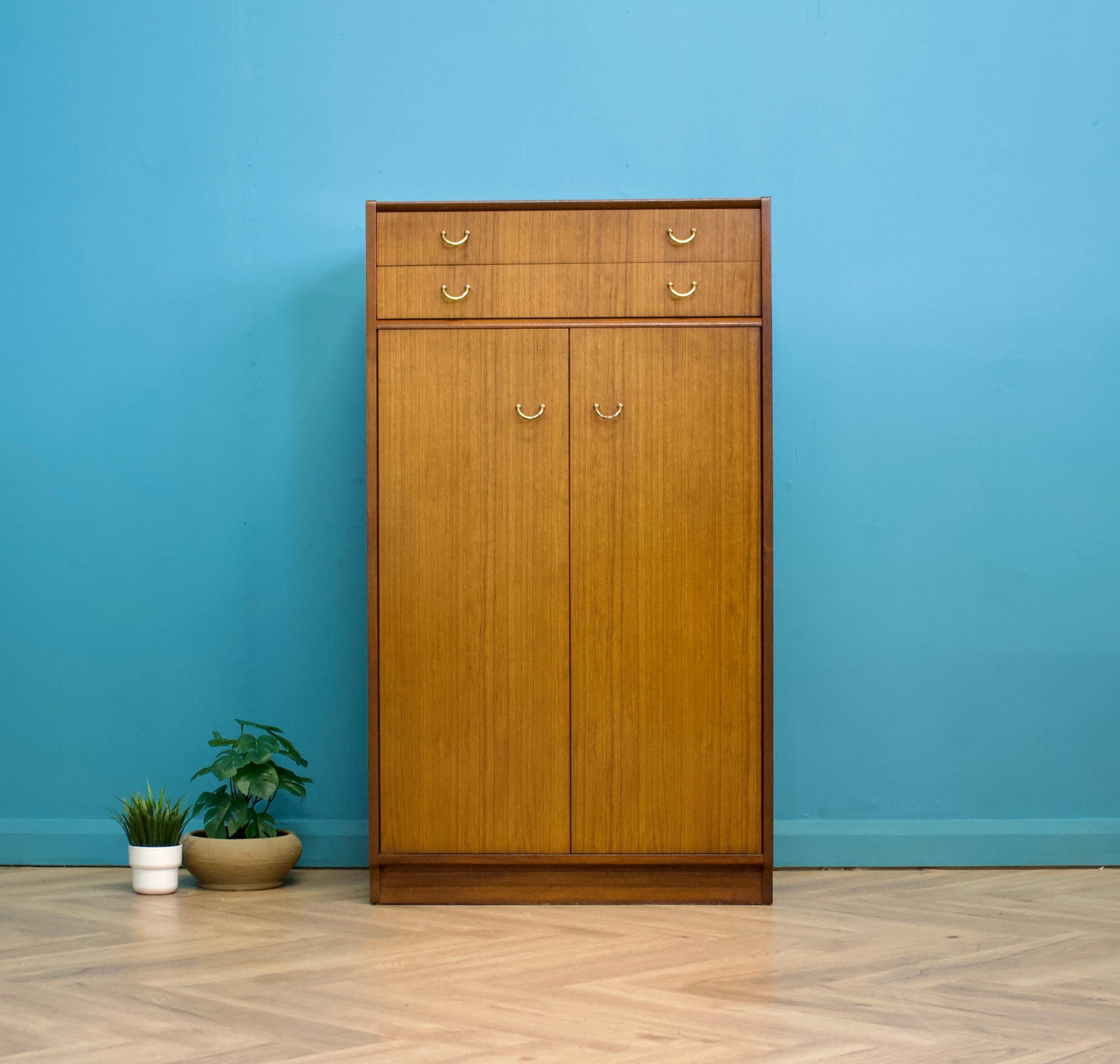 A mid century Tola tallboy from G Plan (E Gomme)
Featuring two drawers and removable shelves - there's also a pull out rail if hanging space is preferred