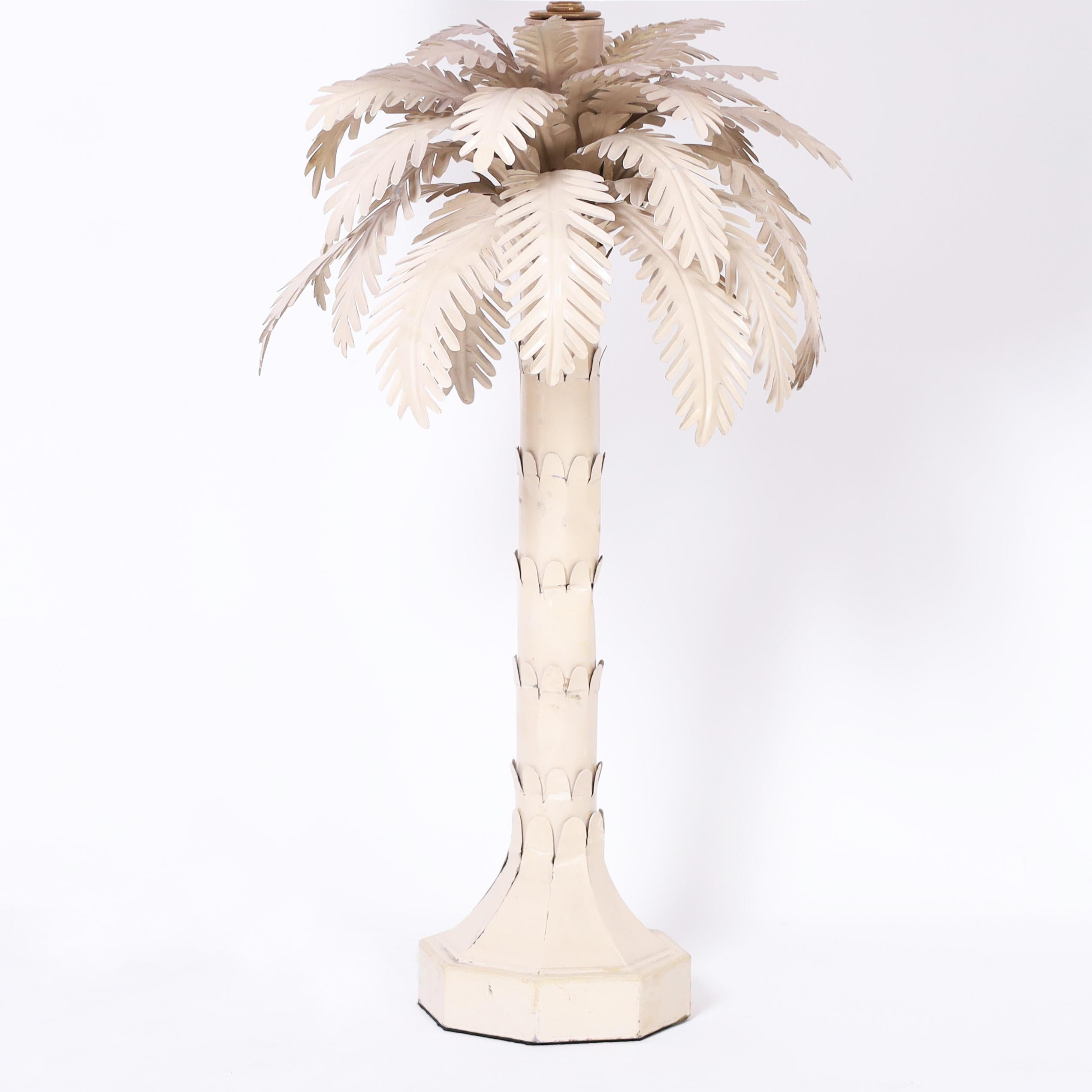 Vintage Italian table lamp crafted in metal with an off white lacquer finish in a chic stylized palm tree form.
