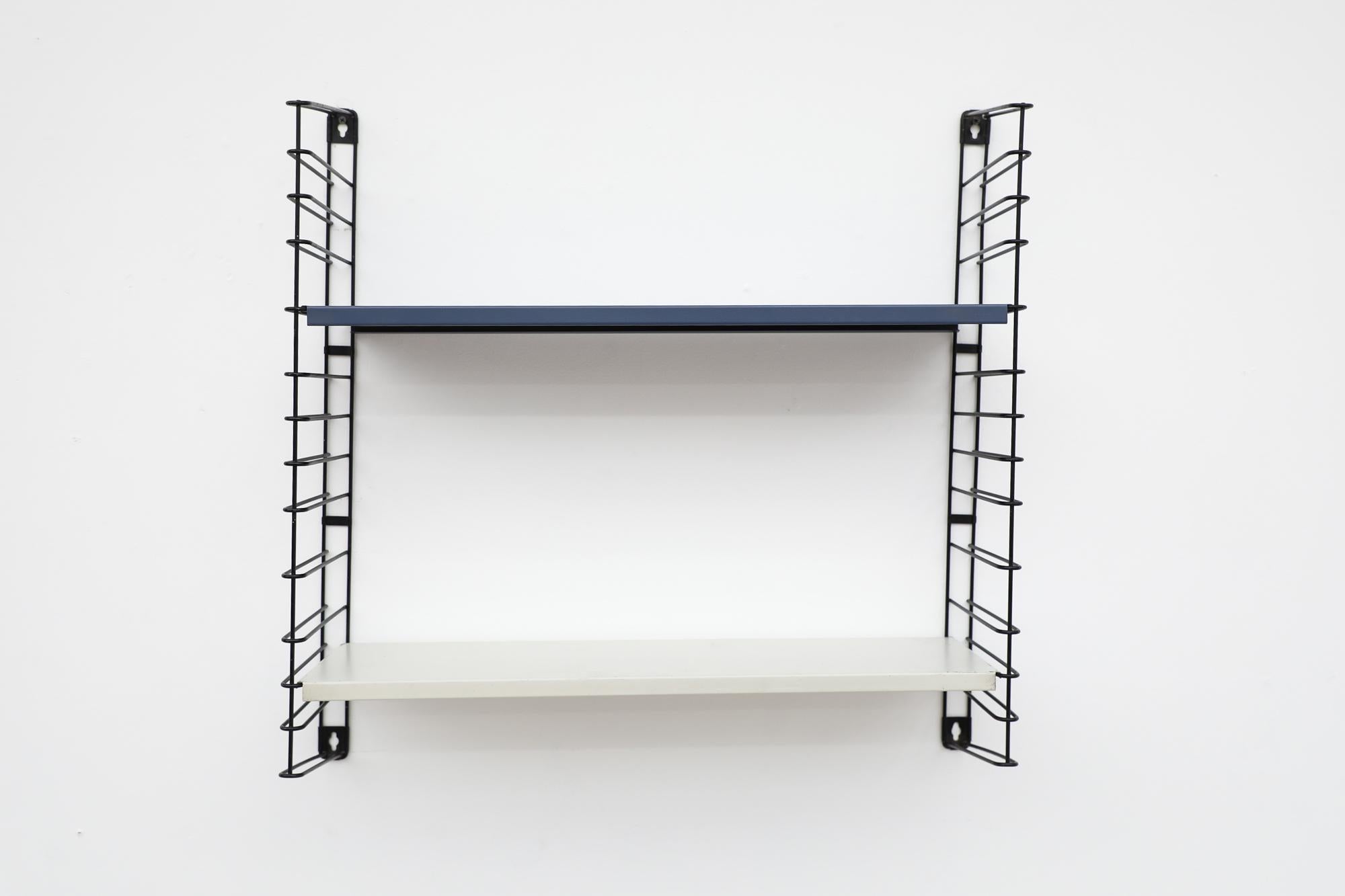 Mid-Century Tomado Industrial shelving with delft blue and white shelves on black enameled metal wire risers. Designed by Jan Van Der Togt. Both shelves rest on the wire risers and can be arranged to different heights. The Blue shelf has been newly