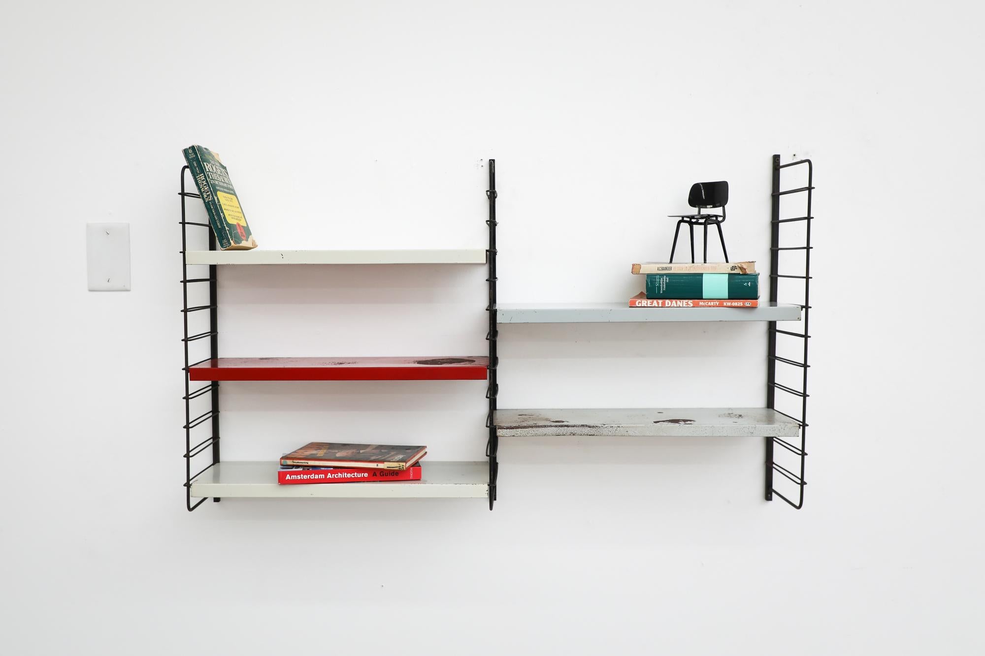 Mid-Century TOMADO style 2 section wall unit with 5 interchangeable sheet metal shelves on black wire risers. In VERY original condition with visible wear including denting, scratching, stains and heavy enamel loss. Others similar units also
