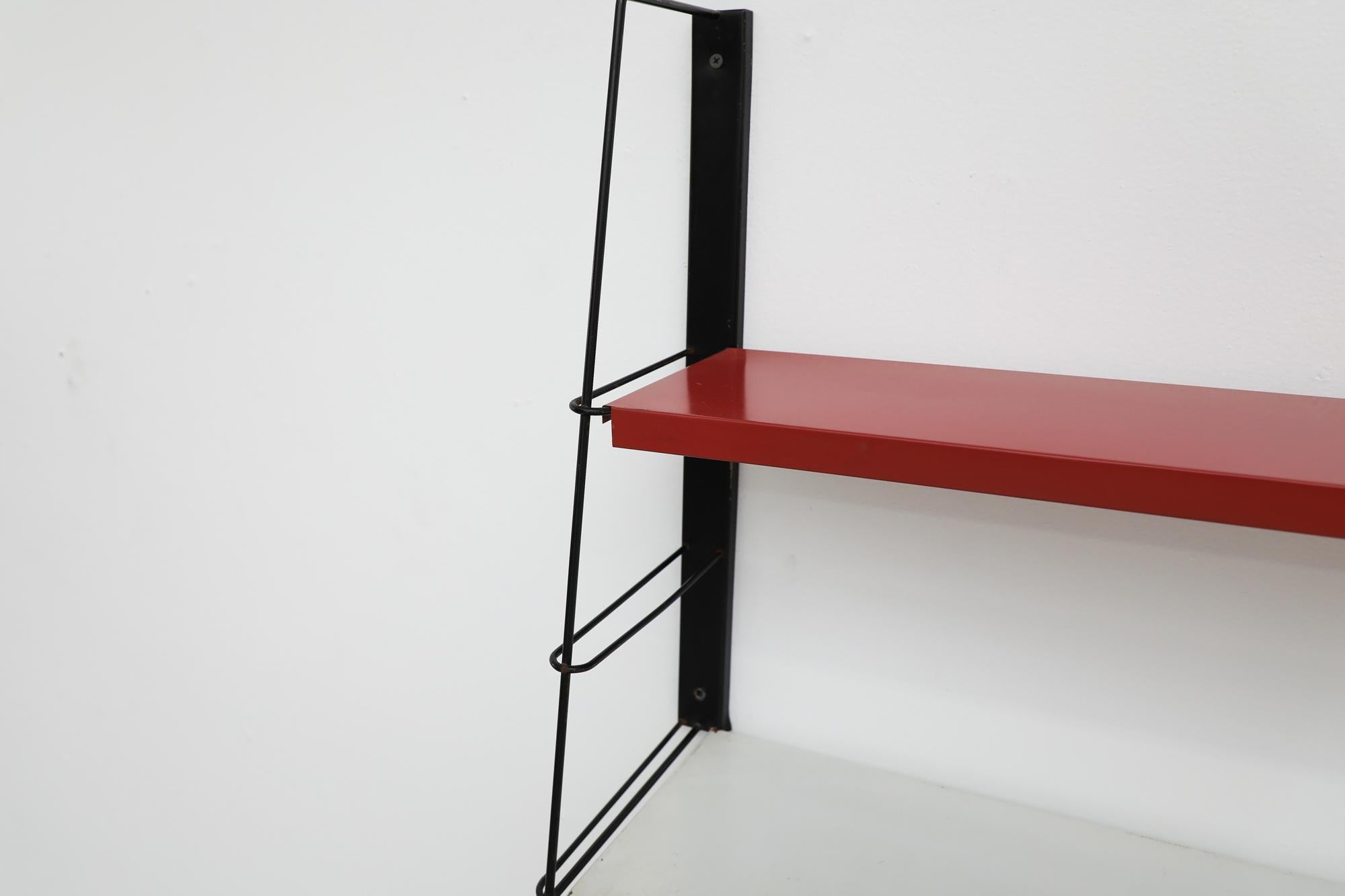 Mid-Century TOMADO Style Metal Black Framed Wall Shelving w/ Red & White Shelves In Good Condition For Sale In Los Angeles, CA