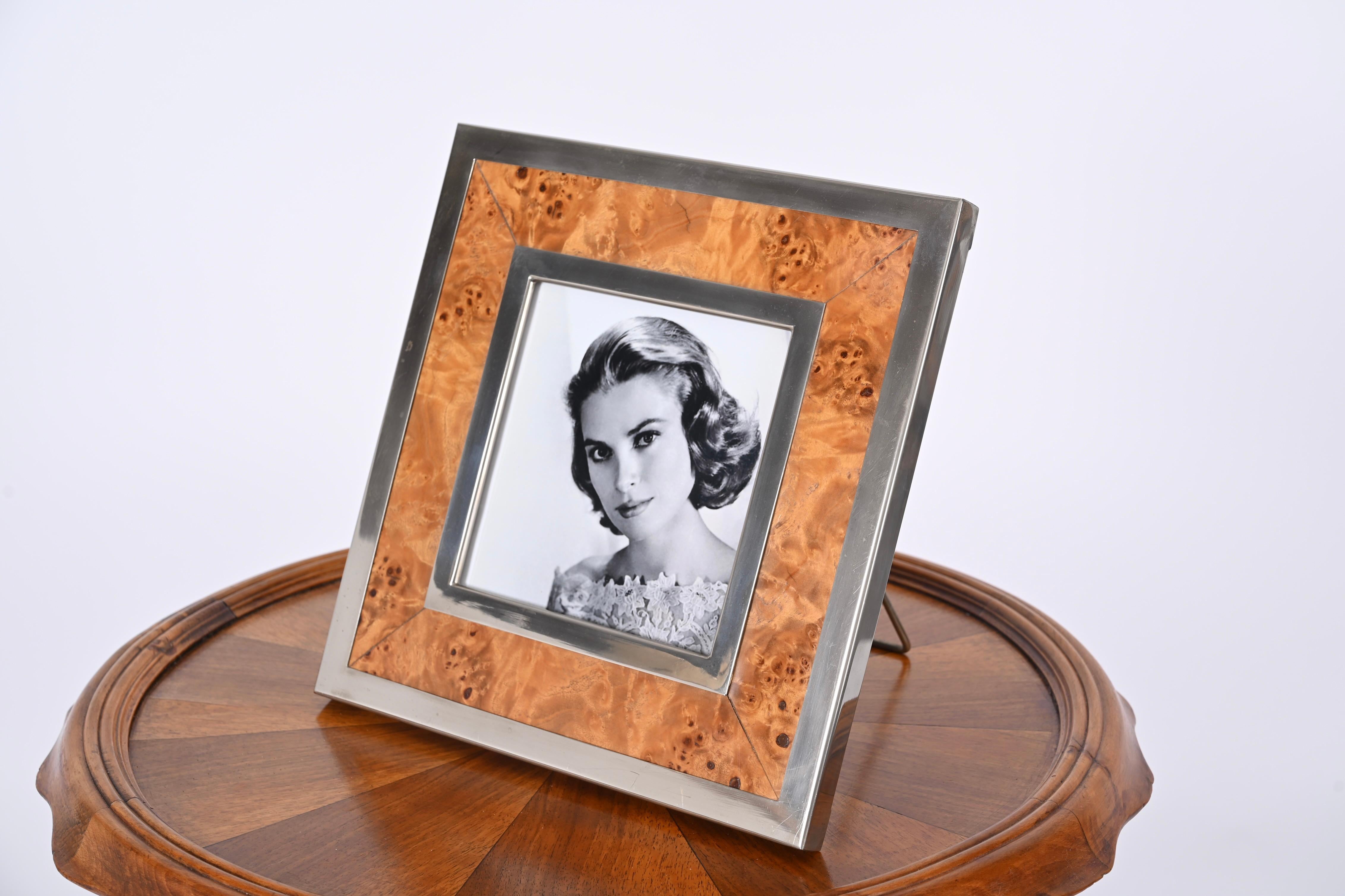 Astonishing midcentury chromed brass and burl square photo frame. This beautiful piece was designed in Italy in the 1970s by Tomaso Barbi and is also signed on the back. 

The photo frame features a gorgeous poplar burl with two square chromed