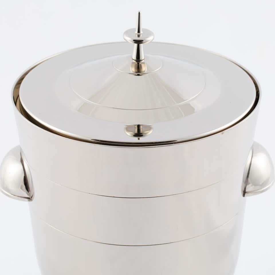 Modernist midcentury ice bucket with signature finial lid and mercury glass liner. Tommi Parzinger for Dorlyn.