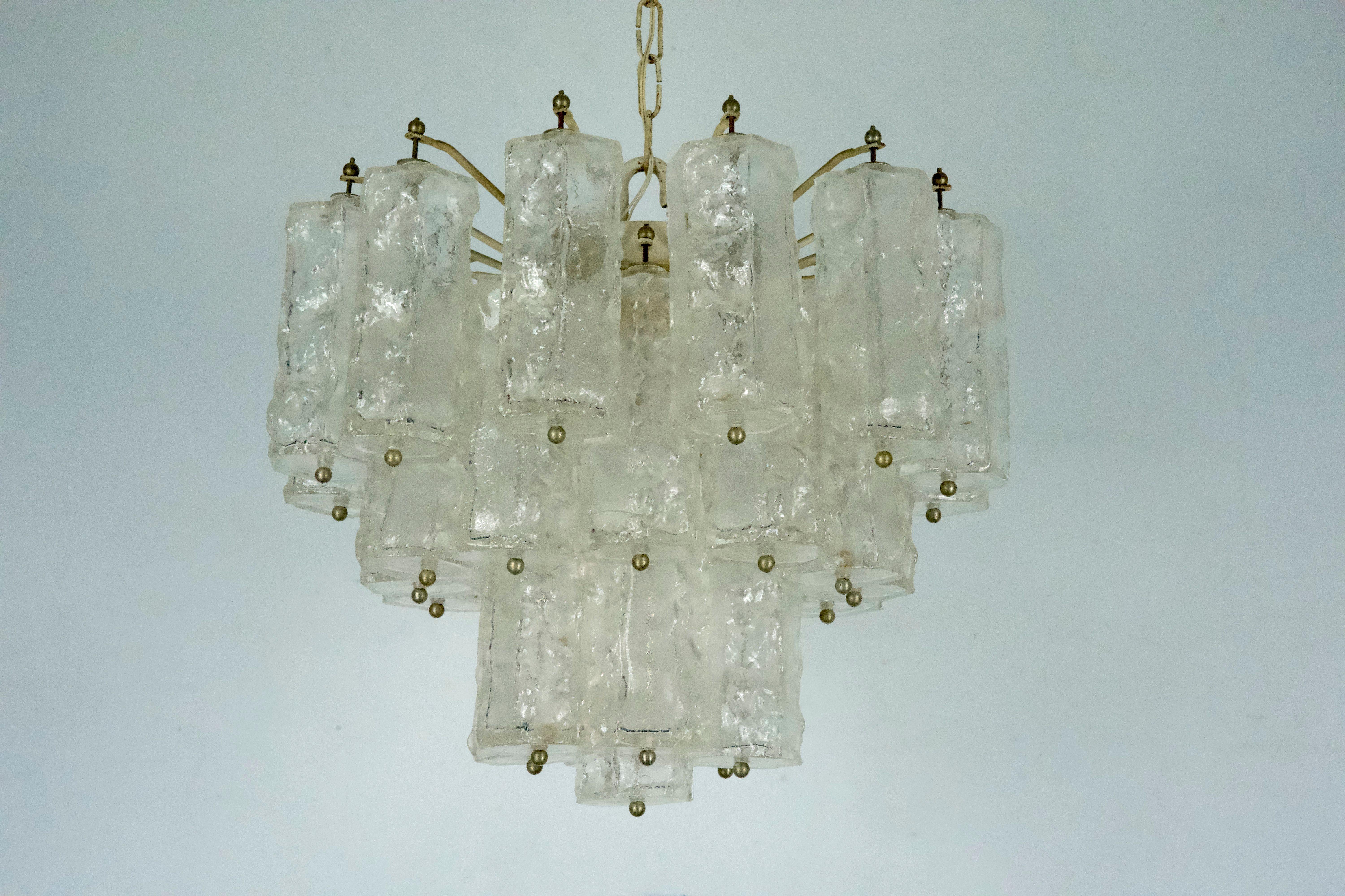 A beautiful Corteccia Murano glass chandelier, designed by Toni Zuccheri for Venini, produced in Italy during the 1960s. The glass elements are in perfect condition with no chips or cracks. The metal components remain in their original vintage