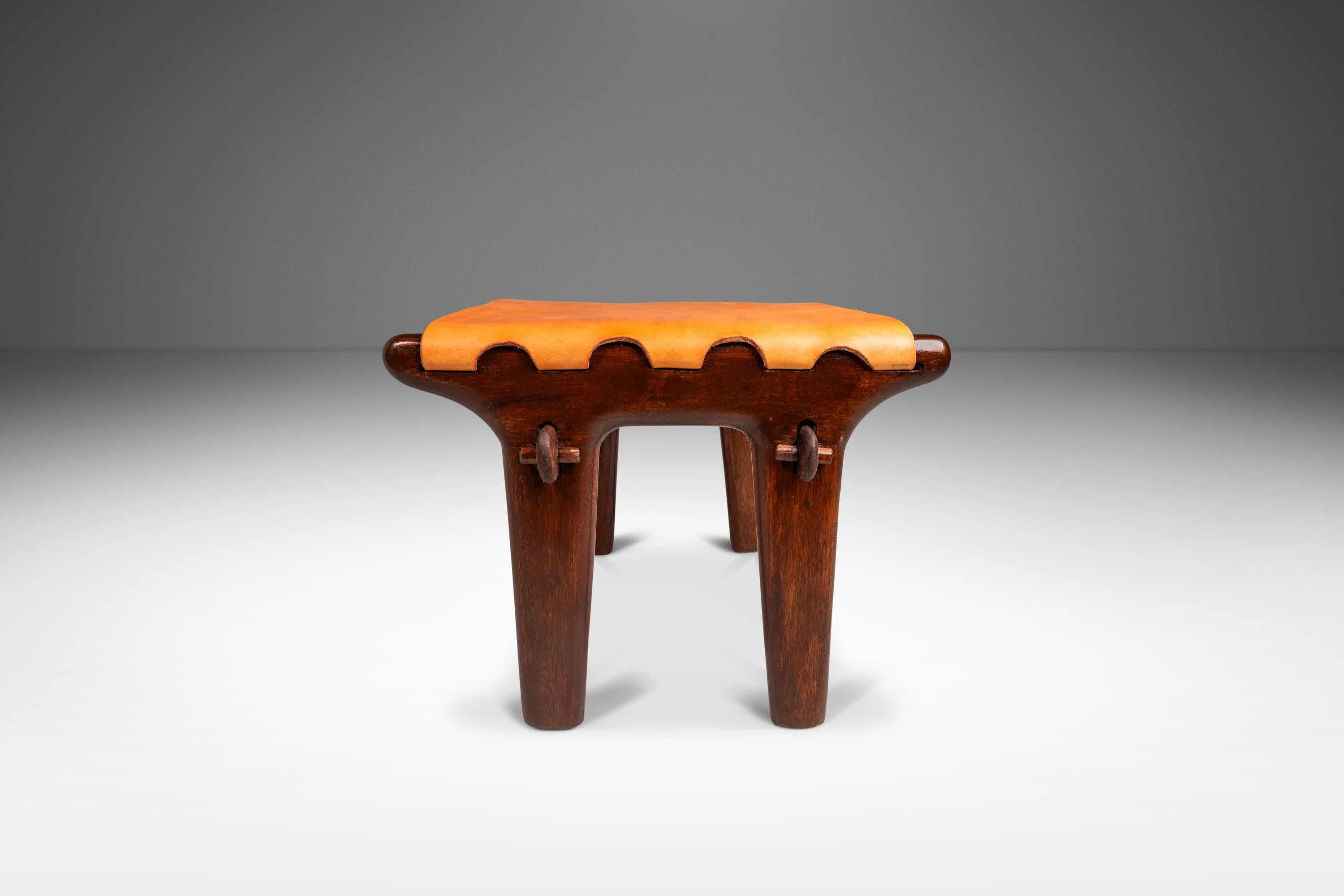 Introducing a rare sling stool by the incomparable Angel Pazmino. Recently and painstakingly restored by our team of craftsmen this iconic ottoman has a new lease on life and we love the results. The solid jacaranda wood frame has been hand-sanded
