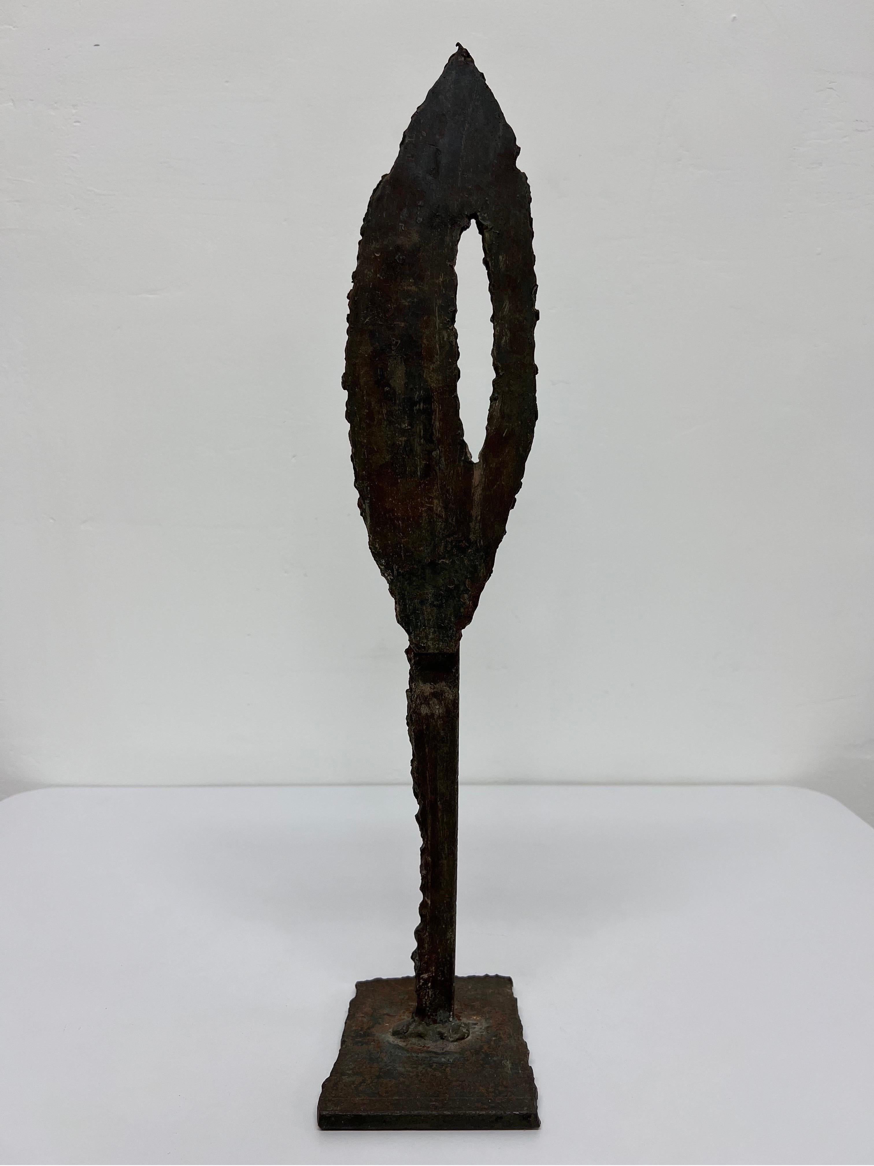 Torch cut and welded spear sculpture with dark bronze patina.