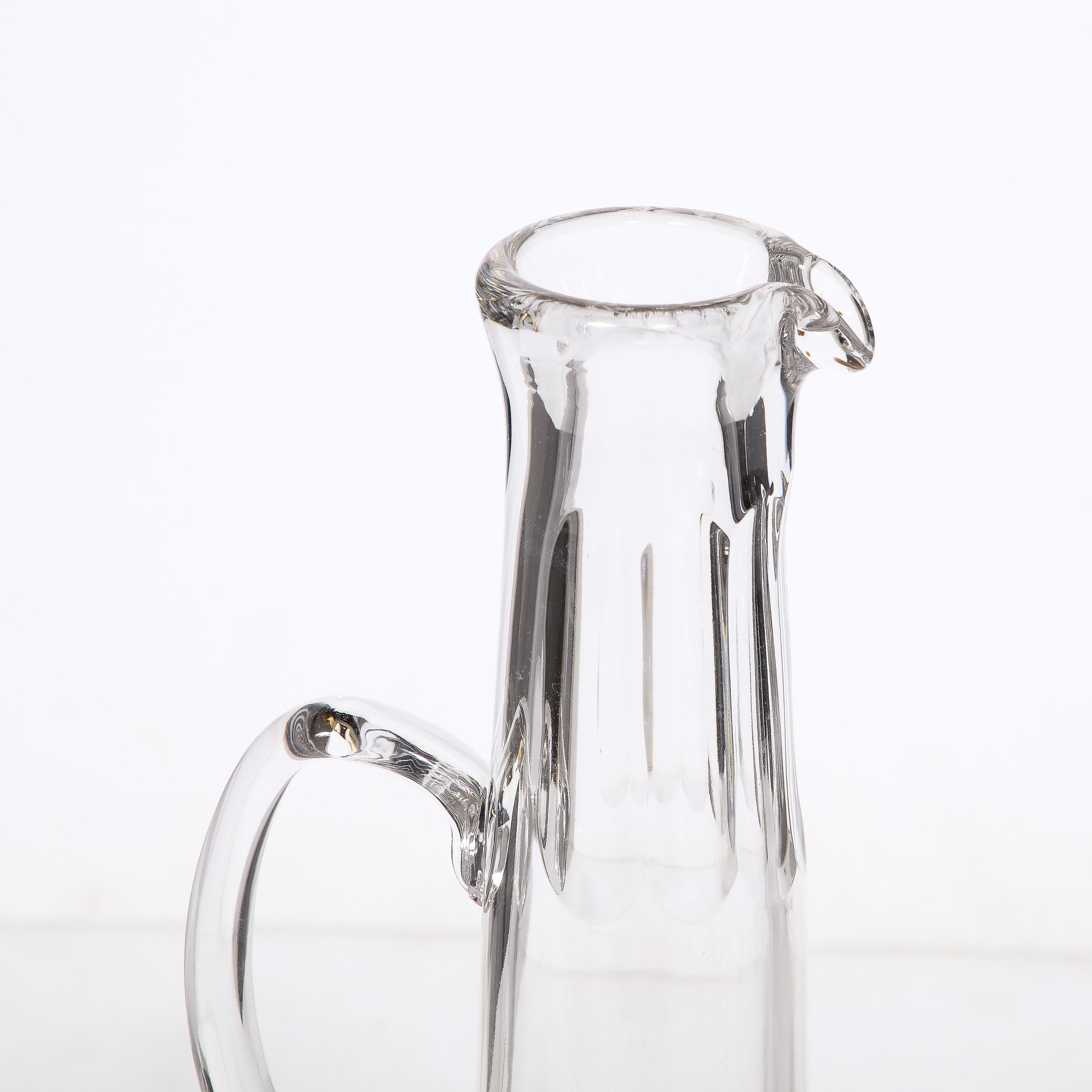 This elegant and beautifully made Mid-Century Modernist Champagne Pitcher entitled 