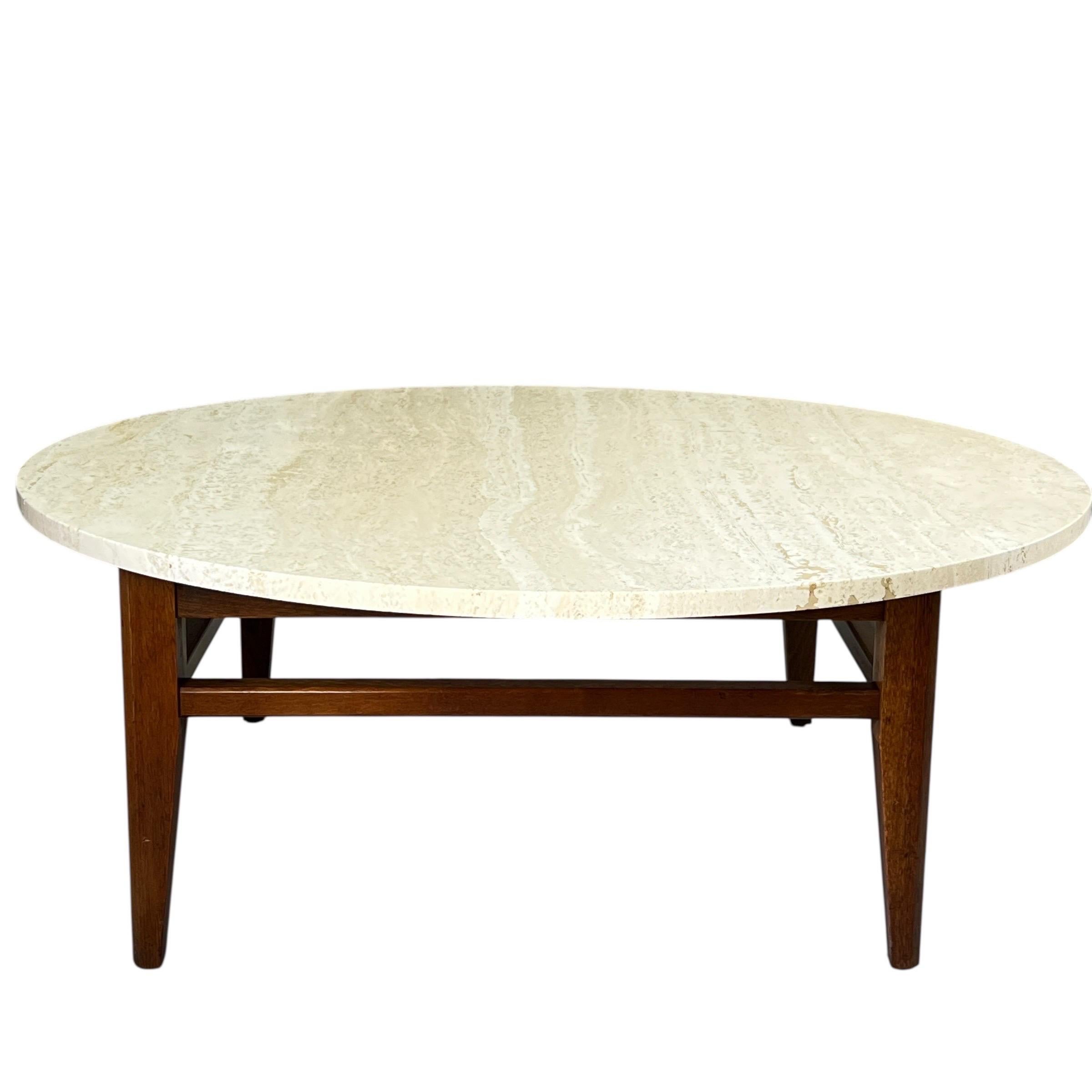 Available for sale is this exceptionally crafted vintage coffee table. It features a beautiful travertine top made in Italy, complemented by a sturdy walnut wood base.