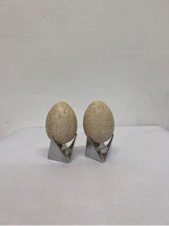 Mid-Century Travertine Egg Sculptures Atop Alessi Roost Egg Cups, a Pair