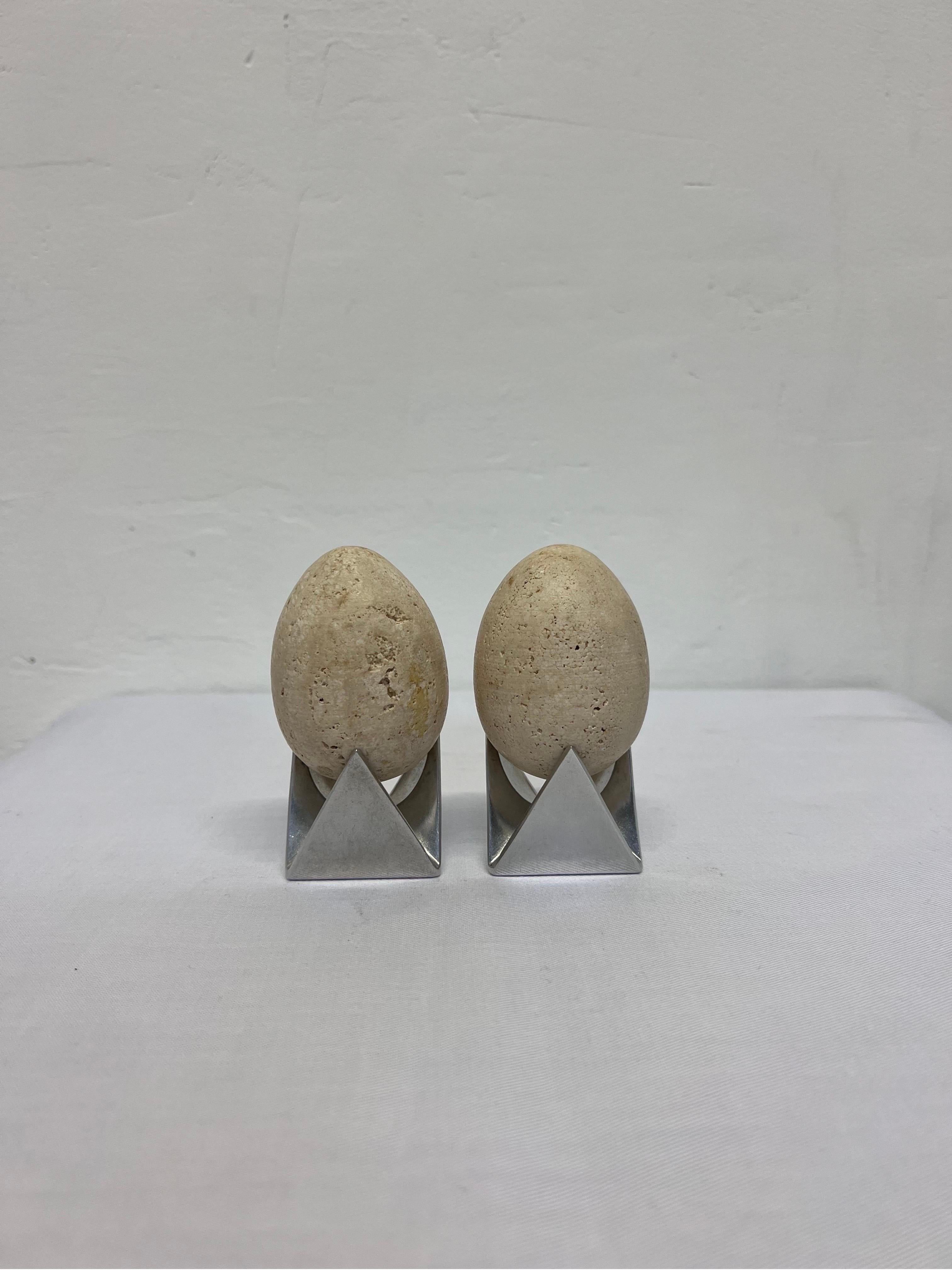 Italian Mid-Century Travertine Egg Sculptures Atop Alessi Roost Egg Cups, a Pair For Sale