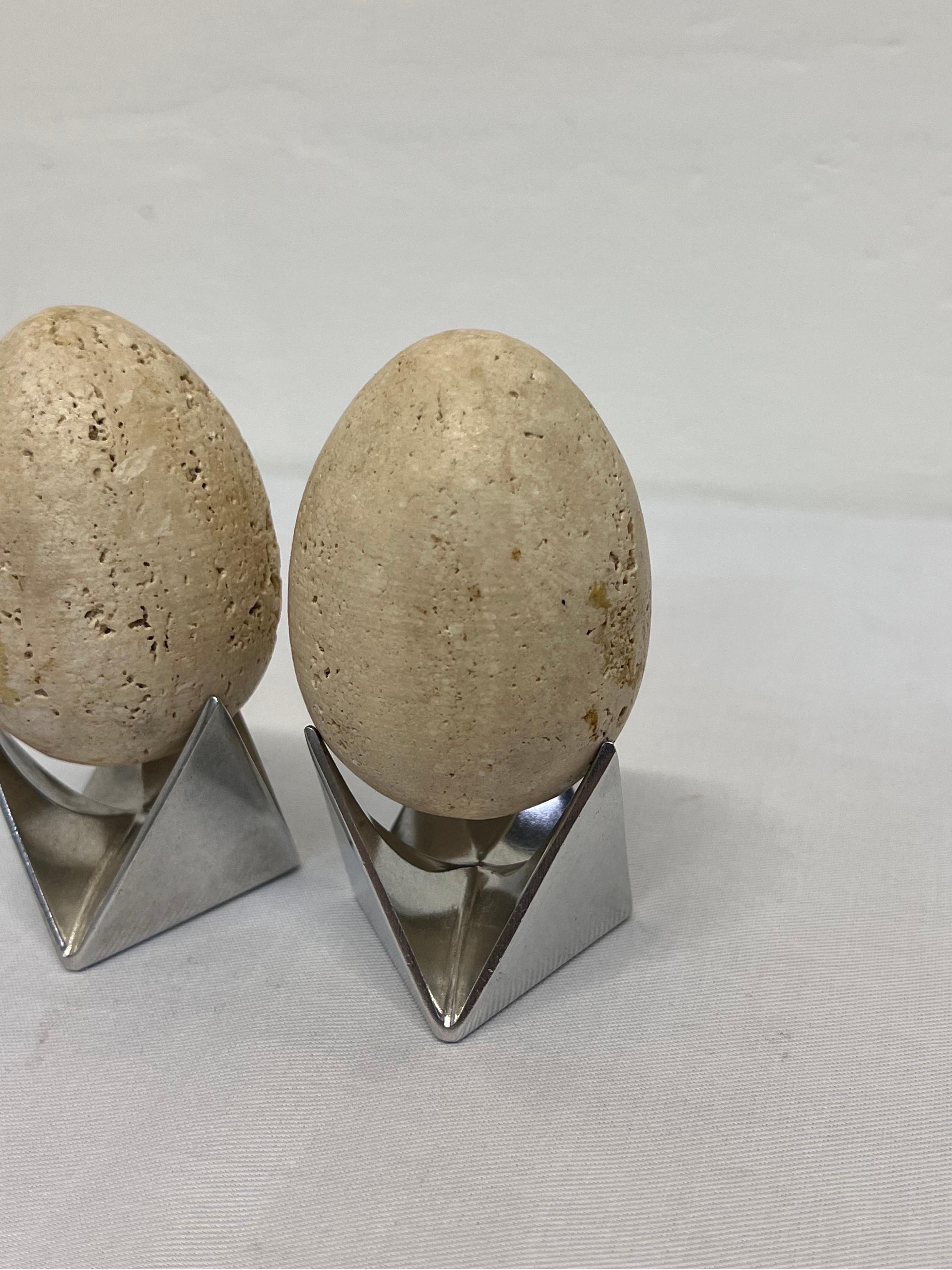 20th Century Mid-Century Travertine Egg Sculptures Atop Alessi Roost Egg Cups, a Pair For Sale