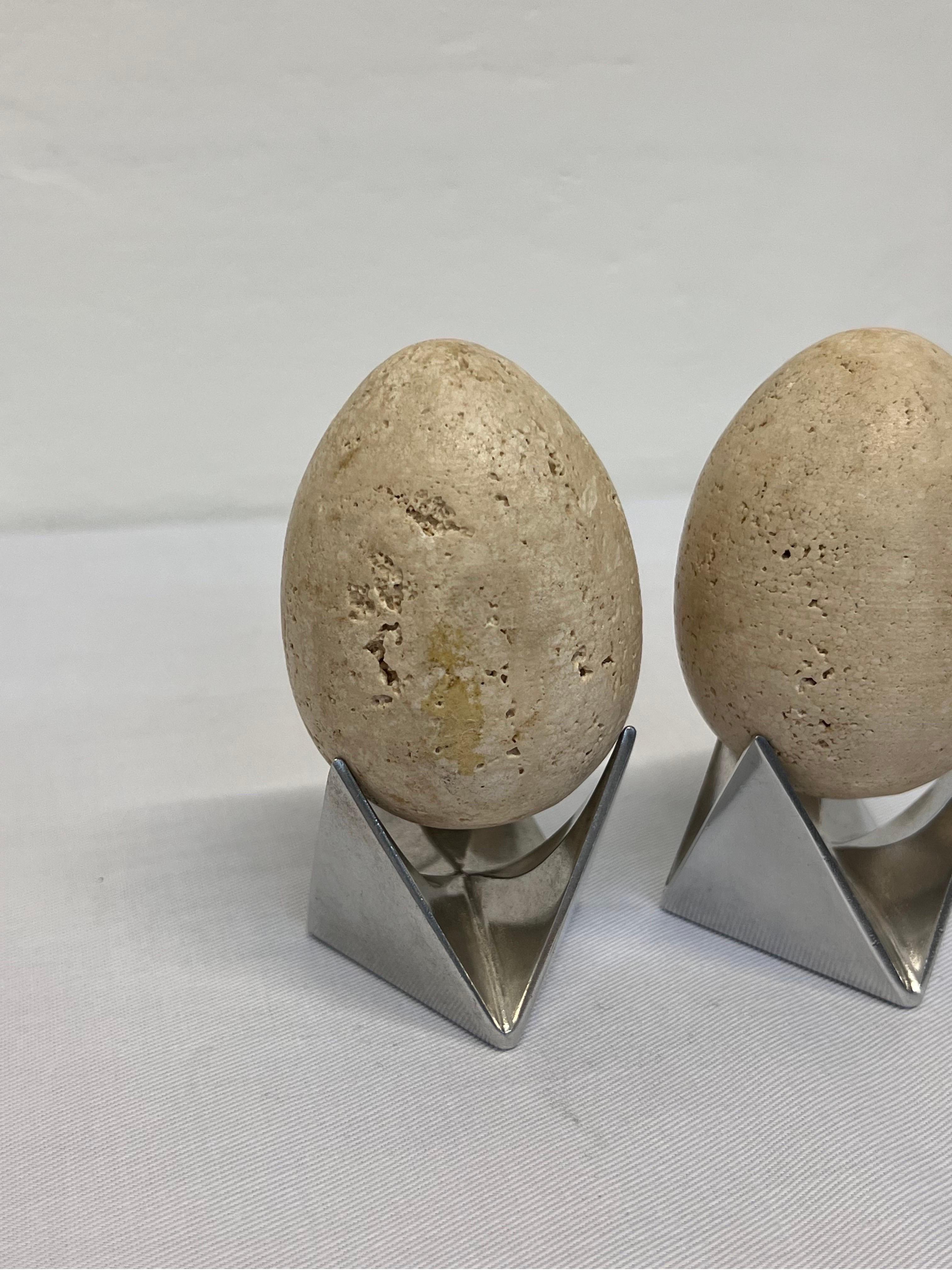 Aluminum Mid-Century Travertine Egg Sculptures Atop Alessi Roost Egg Cups, a Pair For Sale