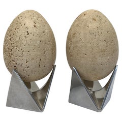 Mid-Century Travertine Egg Sculptures Atop Alessi Roost Egg Cups, a Pair
