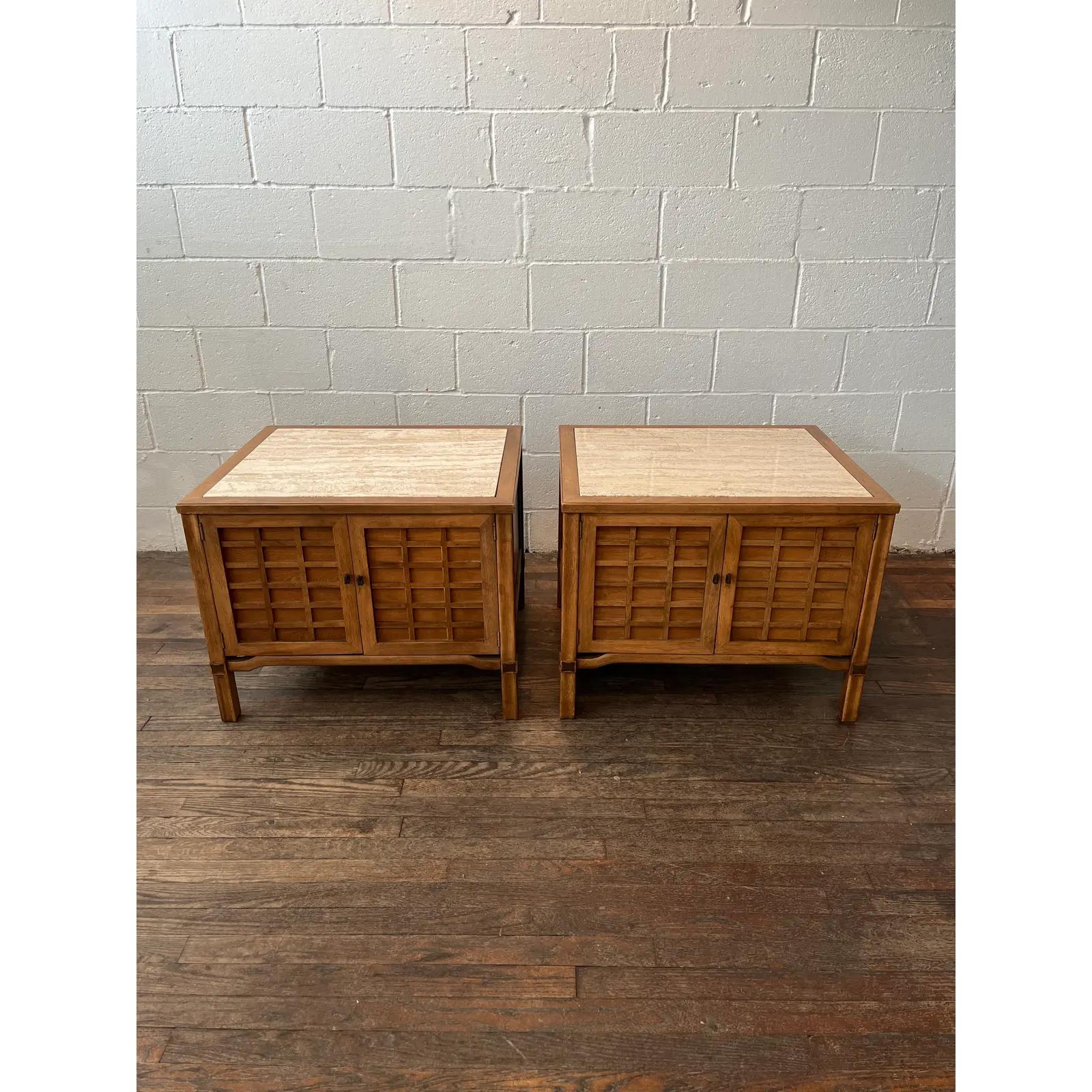 Beautiful pair of sophisticated end tables in the manner of Tomlinson. Great double door grid fronts. Large Travertine tops. Tons of storage.
Curbside to NYC/Philly $300