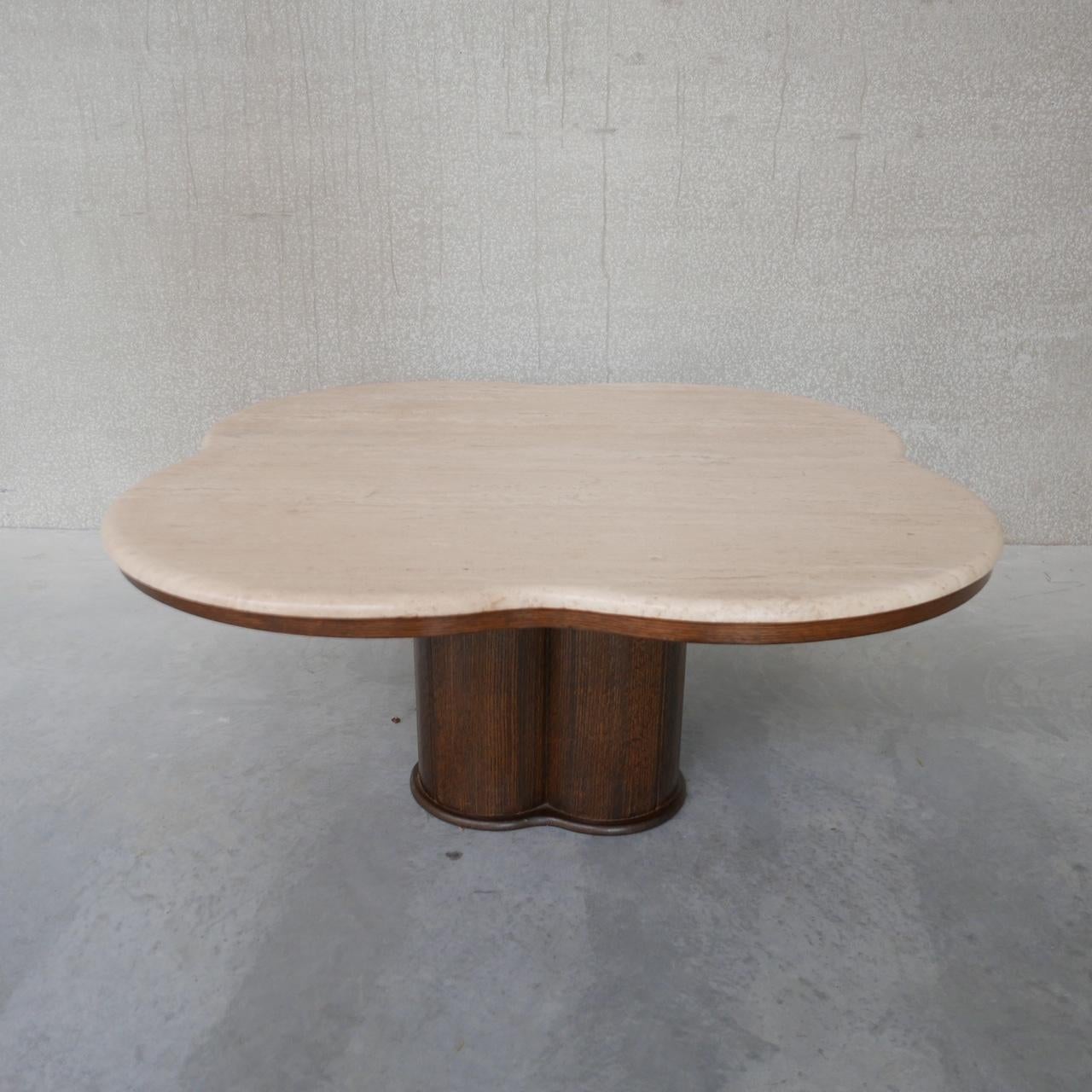 A large four clover leaf style travertine and wood coffee table. 

Belgium, c1970s. 

A pleasant contrast of wood and travertine. 

Immaculate condition. 

Location: Belgium Gallery

Dimensions: 105 W x 105 D x 48 H in cm.

Delivery: