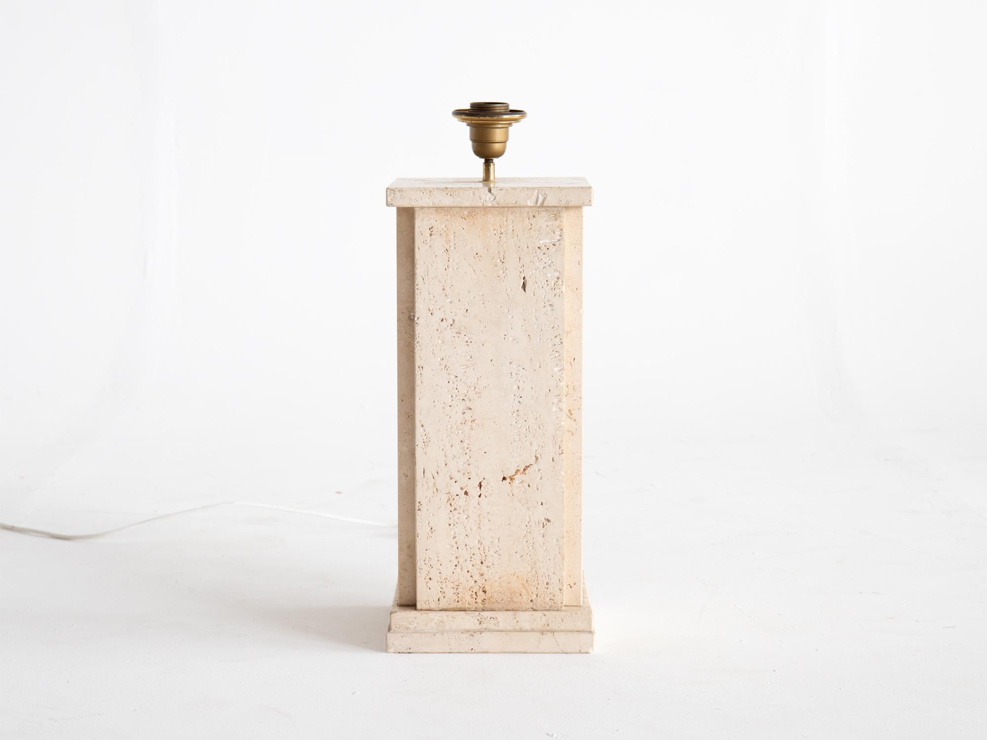 A hefty mid-century travertine table lamp, c. 1970s.

In good order with minor losses and natural imperfections to the stone.

53 x 20.5 x 20.5 cm

20.9 x 8.1 x 8.1 “