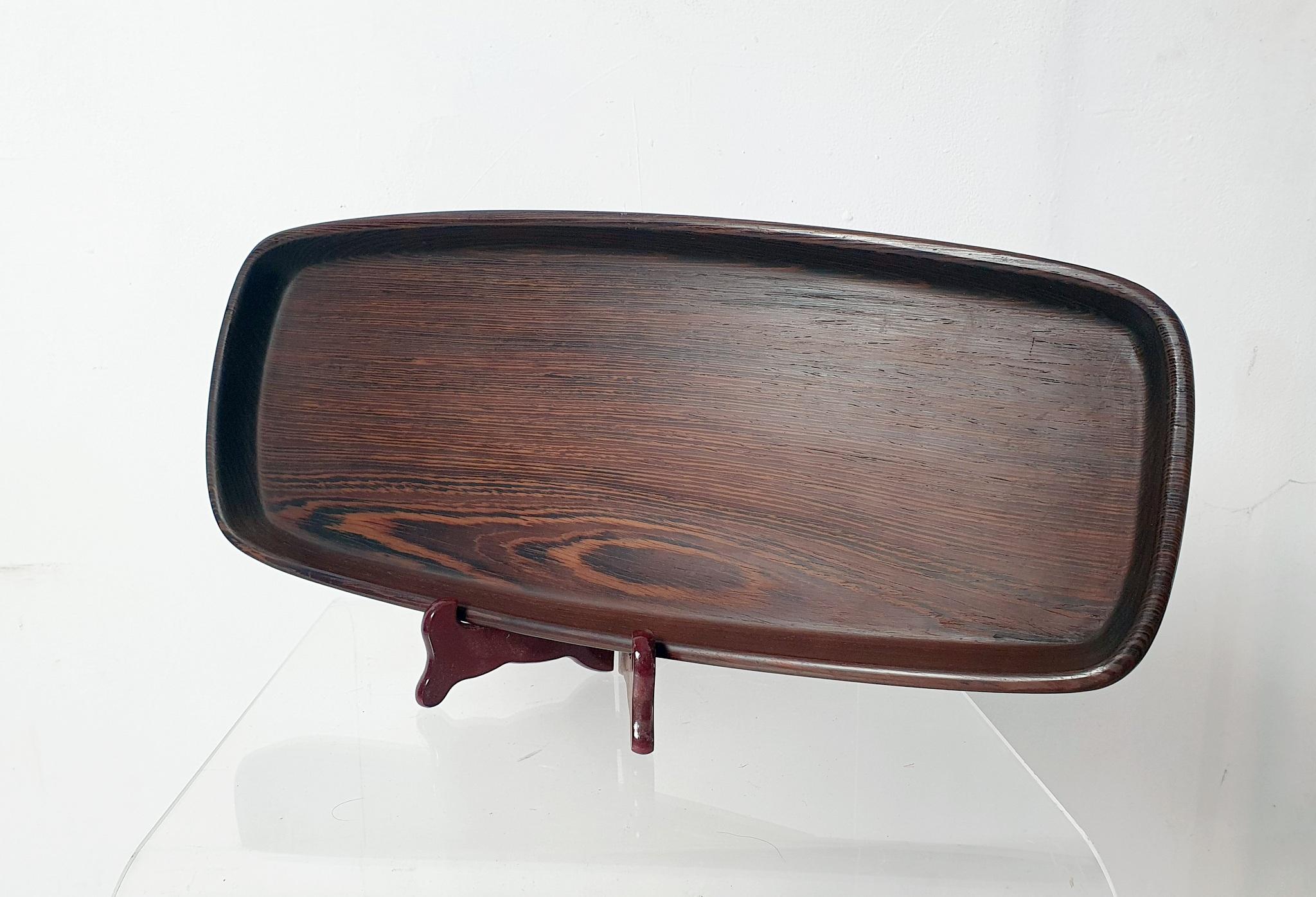 A lovely wooden tray by renowned by danish designer Hans Gustav Ehrenreich. The tray has a somewhat irregular shaped design with organic soft shapes where the material is shown to it's fullest. The condition is very nice and it is almost unused. The