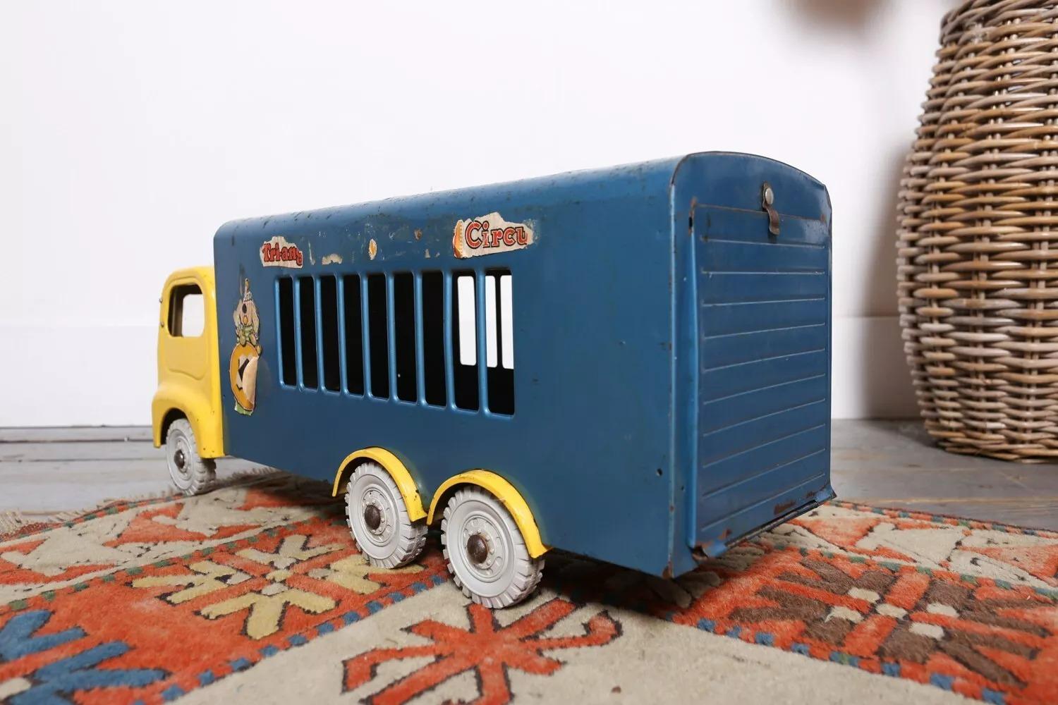 Tri-Ang Circus Truck Toy

This bright blue and yellow mid-century Tri-ang Circus toy truck makes a fabulous display piece.

Made from tin, the windscreen is cracked (can be removed if necessary), but overall, the truck is in very good condition. It