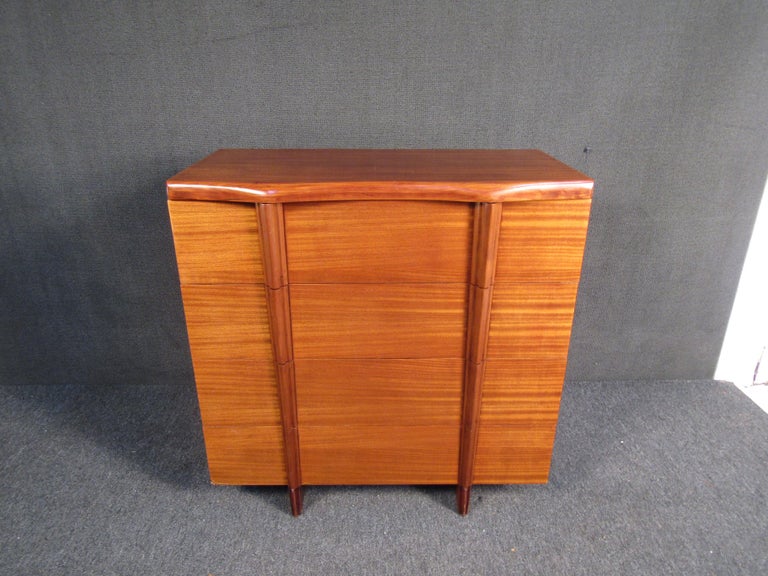 Stunning mid-century modern dresser by Tri-Bond Furniture. Interesting design featuring four drawers. 
(Please confirm item location - NY or NJ - with dealer).
 