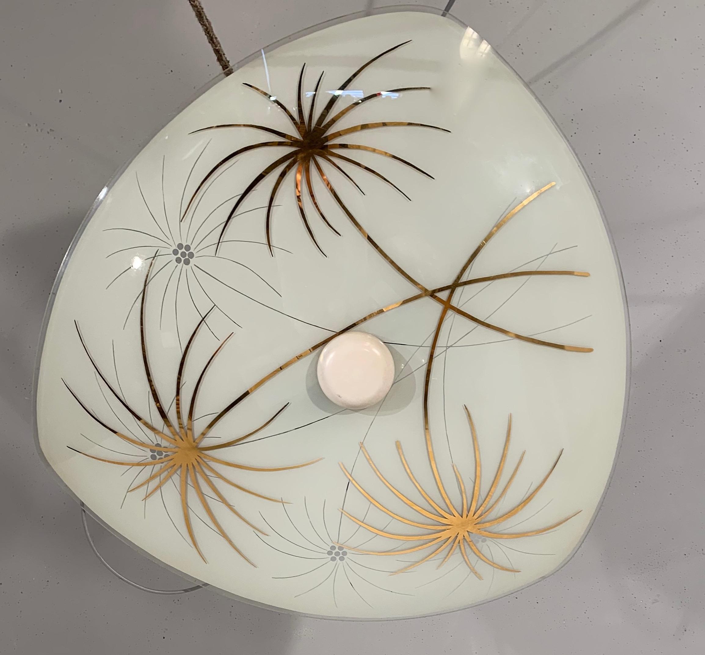Beautifully decorated and colorful light fixture from the midcentury era.

This Mid-Century Modern work of (lighting) art is another one of our recent, wonderful finds. As you can see, the sleek and almost flat glass shade comes with a stylish,