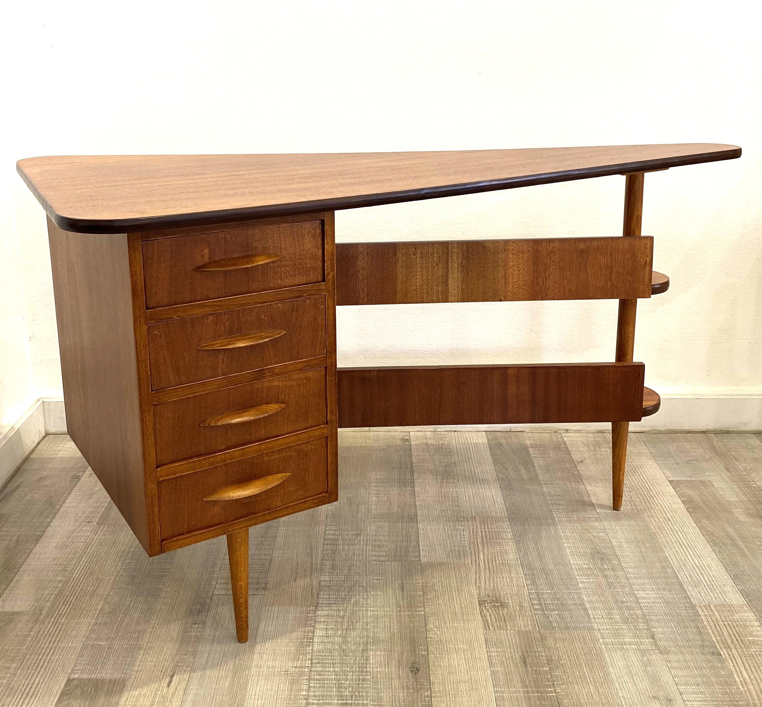 Mid-century triangular desk with drawers in an excellent condition.