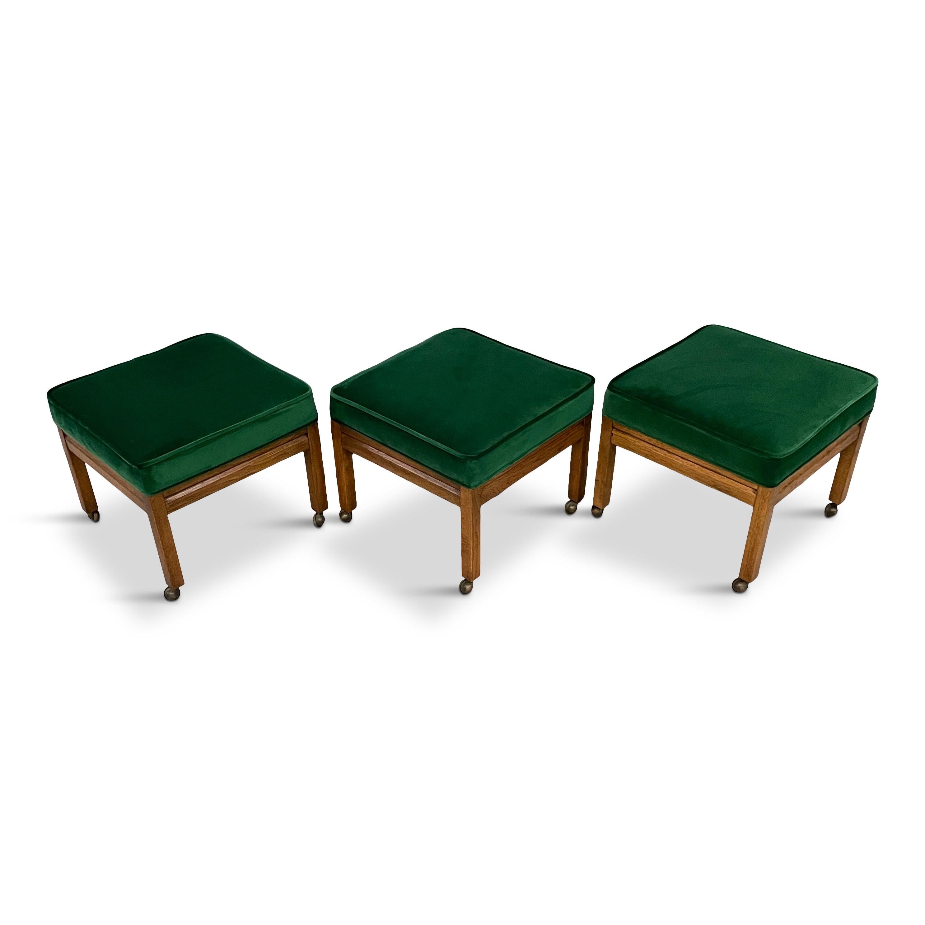 This trio of stools have been lovingly reupholstered in a wonderful emerald velvet that enhances the beauty of the pecan wood base. These stools have casters that you can keep or I'll remove them if you don't like them.