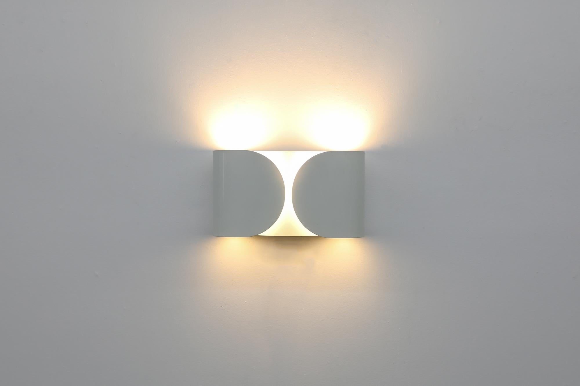 Original 1960s TS-Foglio wall mounted sconce designed by Tobia Scarpa for Flos. Scarpa's history was closely connected to Flos: He was one of the first designers to be invited to the company right after its foundation in Merano, Italy in 1960. One