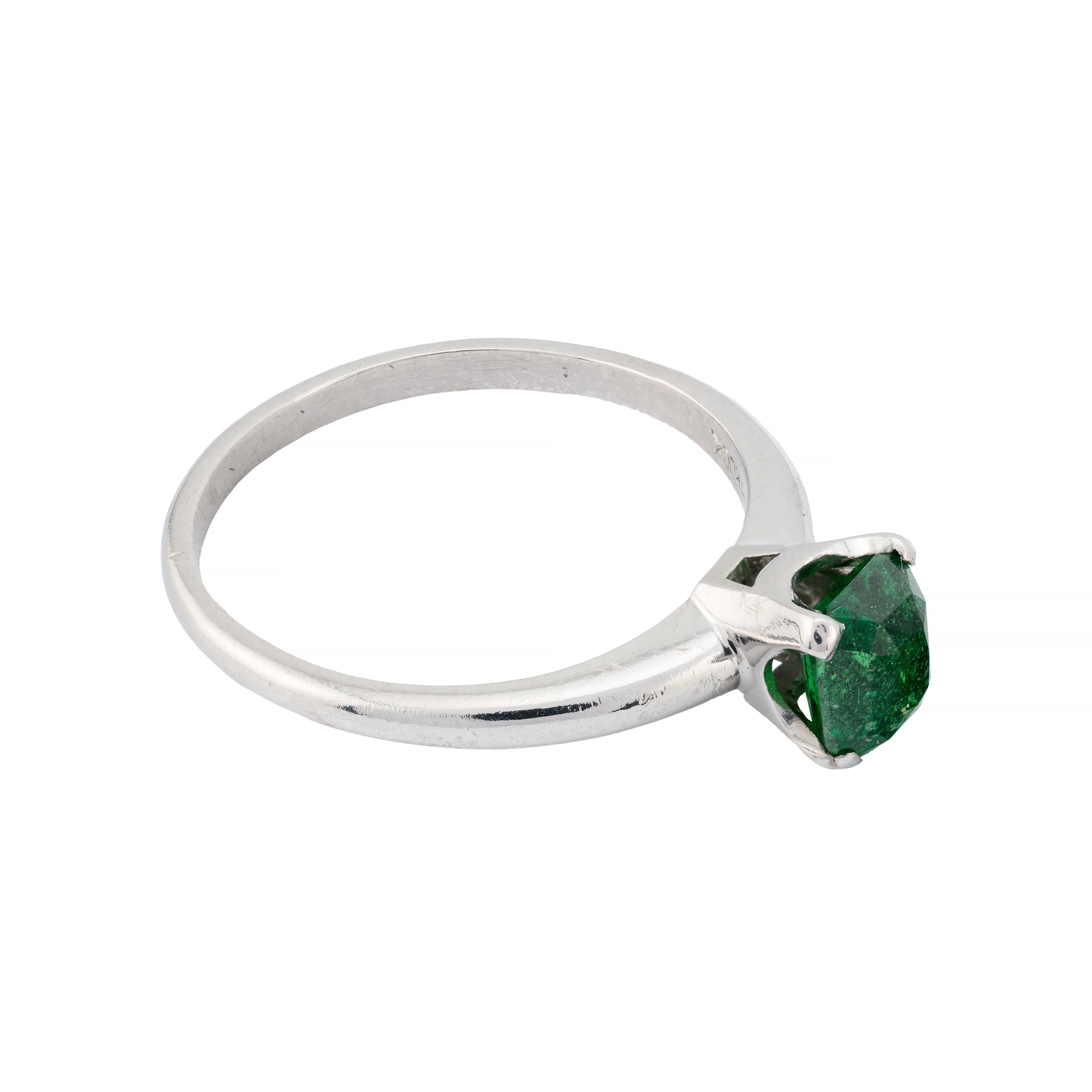 Aston Estate Jewelry Presents:

An exquisite ring showcasing a 1.65-carat antique cushion-cut tsavorite garnet, radiating a vibrant green hue. Set in a sleek platinum band, this piece embodies elegance and sophistication.

Crafted in 1940, this Art
