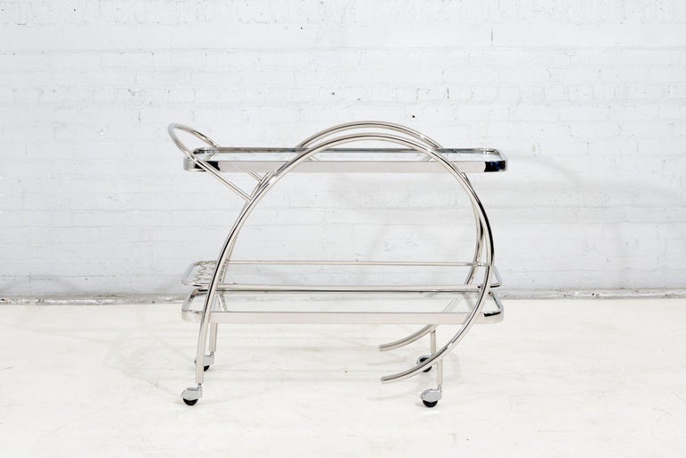 Mid Century Tubular Chrome and Glass Bar Cart/Trolley, 1960.  Original excellent condition.    In the style of Gilbert Rohde.
