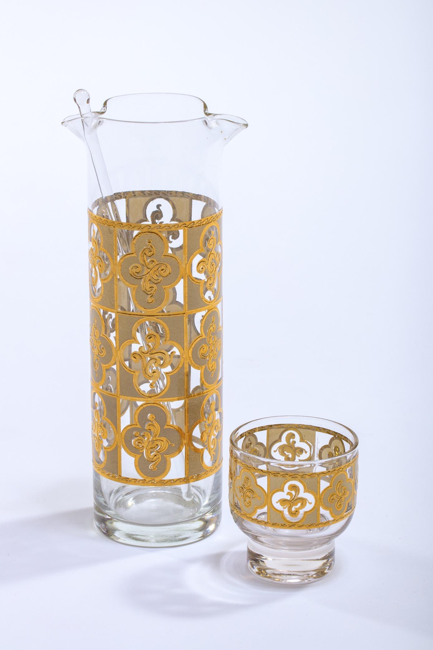 22-karat gold printed cocktail mixer and matching set of 6 cocktail glasses in a rare Tudor like style, circa 1970. The set is in great condition with little to no wear. Beautiful addition to any bar or bar cart, or the perfect unique gift for a