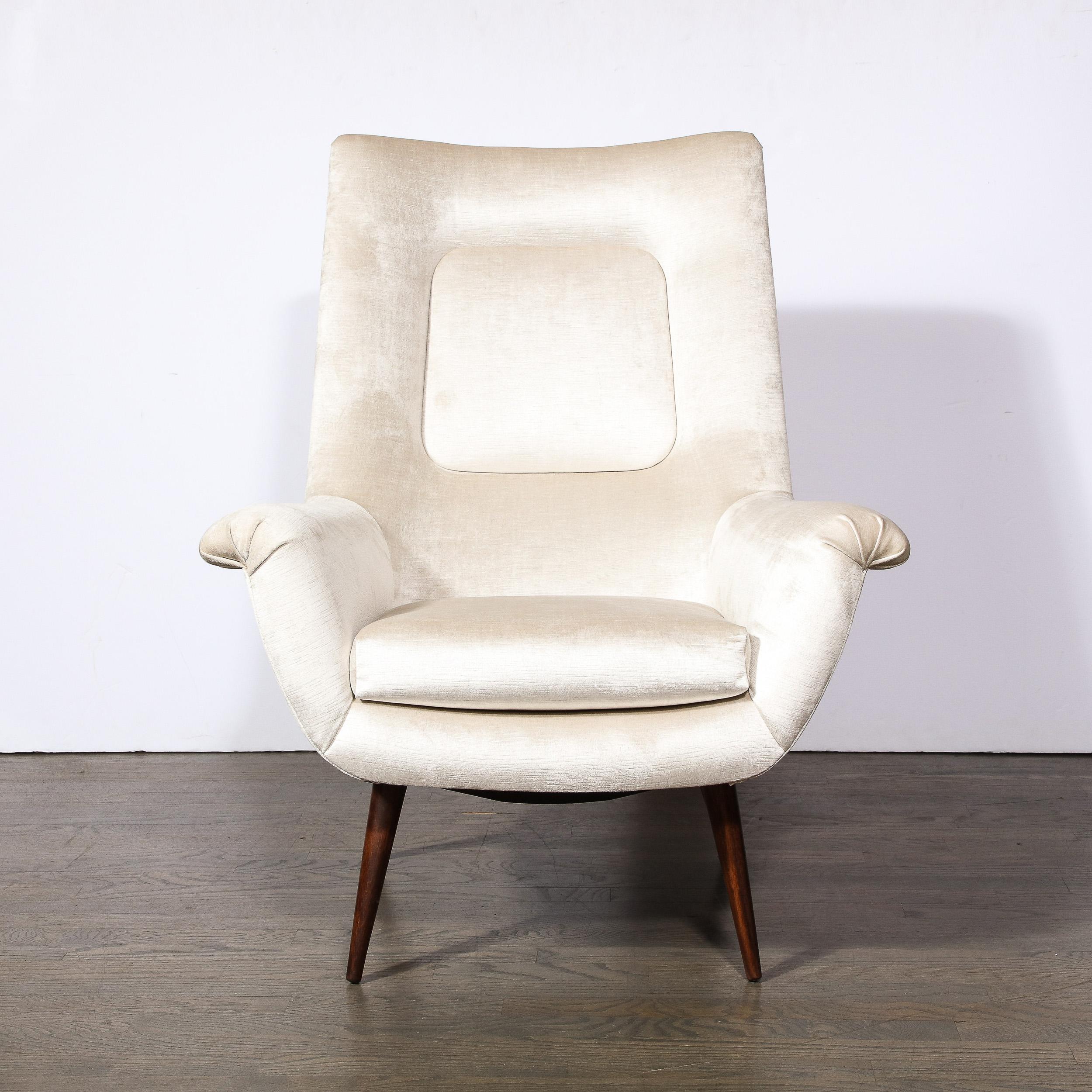 One of Lawrence Peabody's most sought-after designs, this chair is a luxurious addition to your home. Featuring high back profile and simplified scroll form arm rests, forming a beautifully sumptuous lounge chair newly upholstered in Platinum