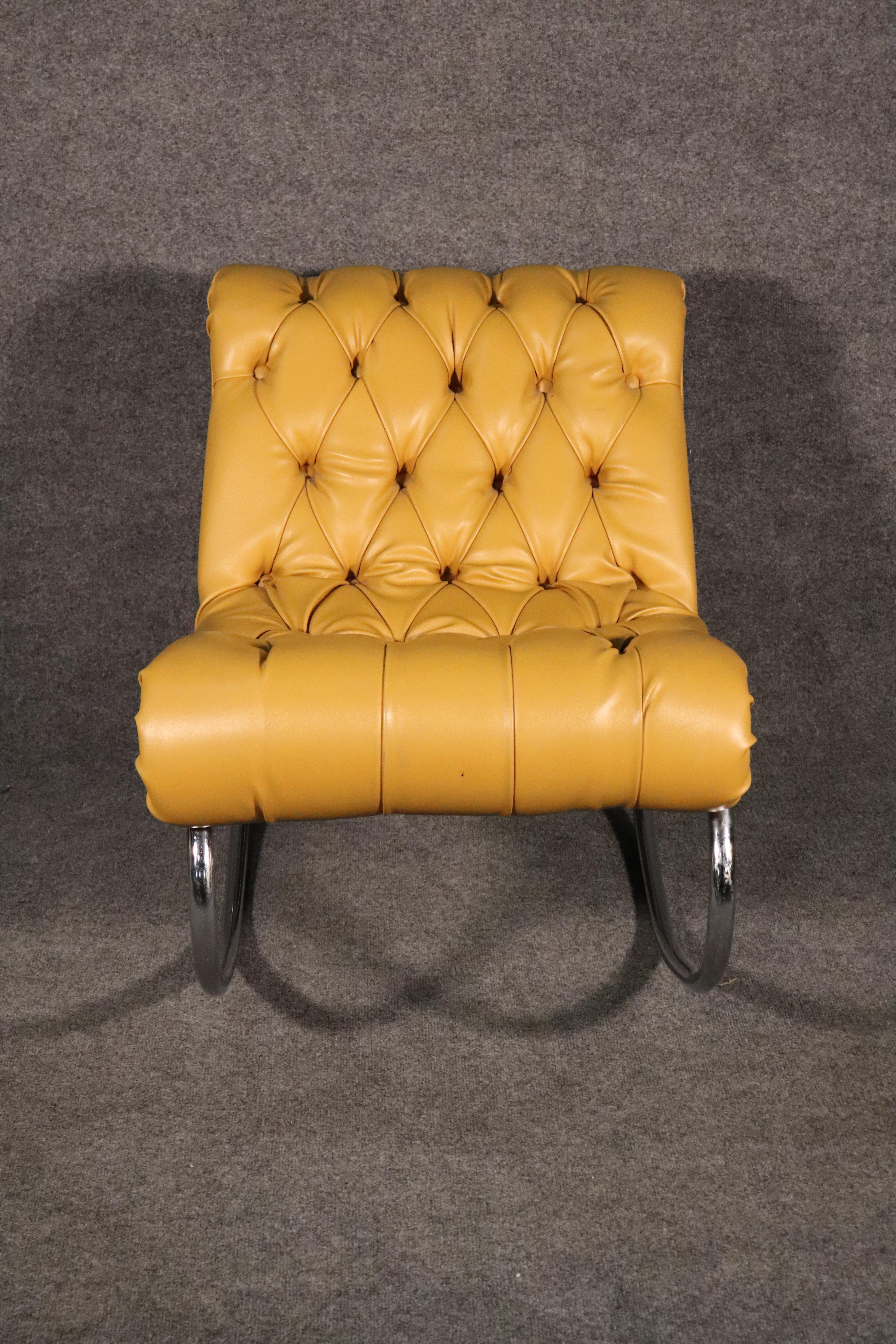Tufted leather rocker with polished chrome frame. Great mix of modern and chesterfield style.
Please confirm location.